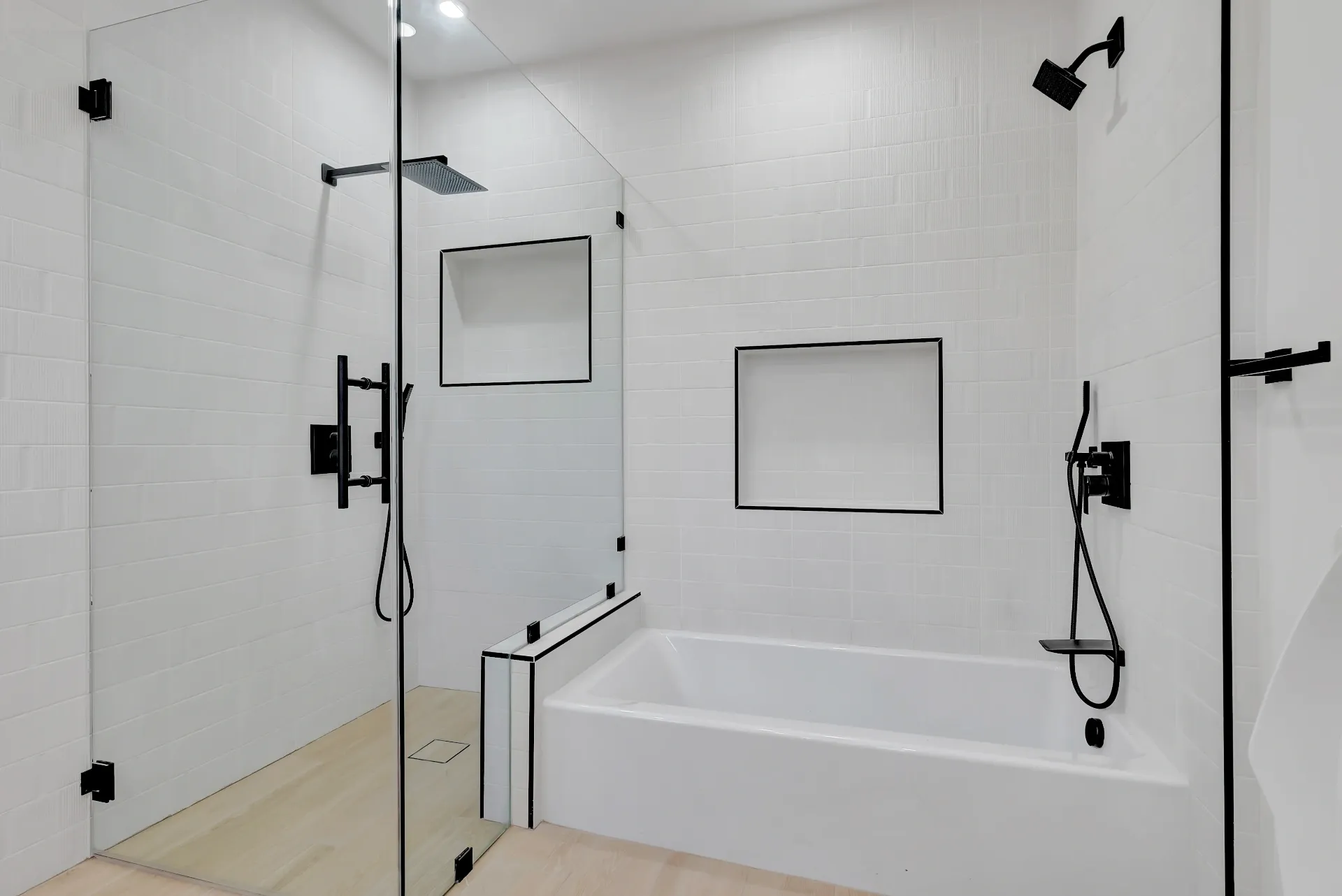 1145 S Longwood Ave Mid-Wilshire — Bathroom: Modern primary bathroom with spa tub, glass shower, and black fixtures