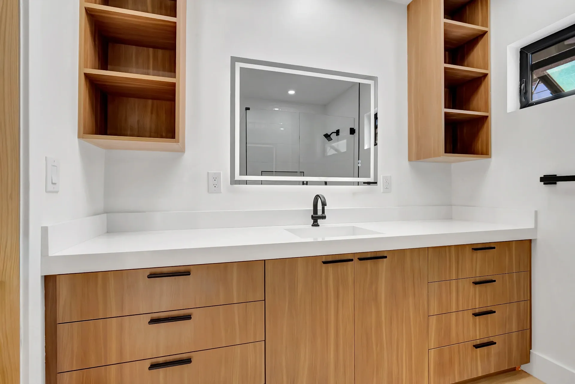 1145 S Longwood Ave Mid-Wilshire — Bathroom: Contemporary bathroom vanity with white quartz countertop and wood storage