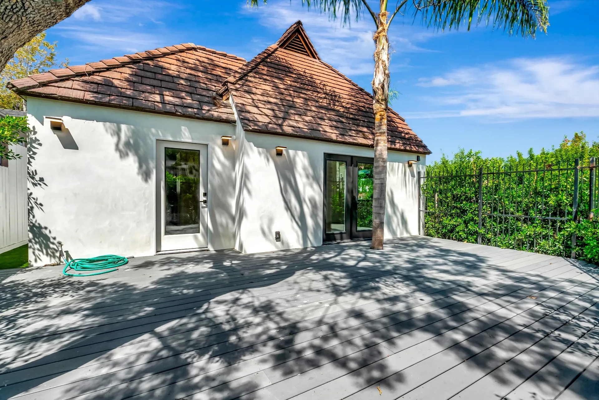 1145 S Longwood Ave Mid-Wilshire — Exterior: Backyard deck area with outdoor entertaining space