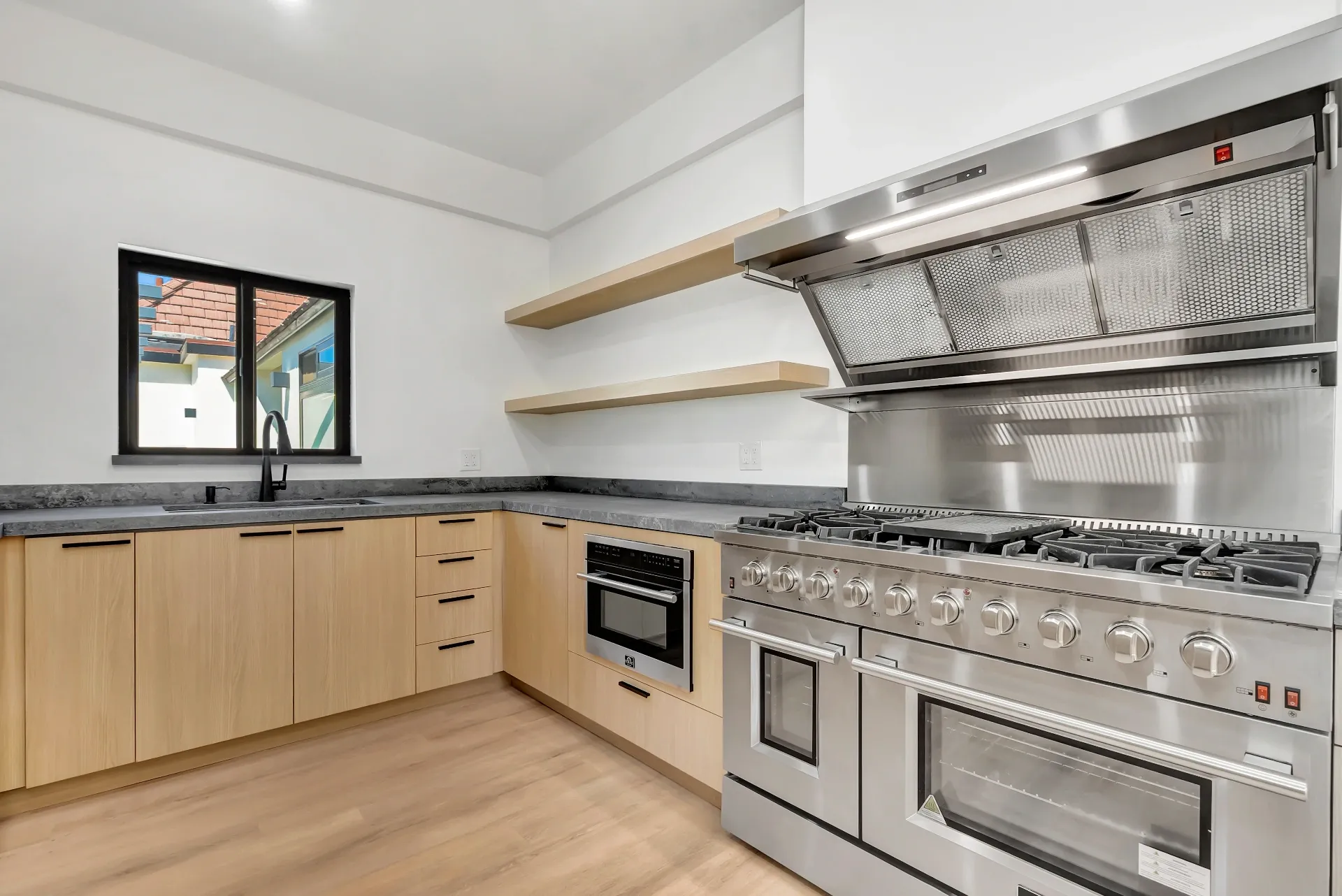 1145 S Longwood Ave Mid-Wilshire — Kitchen: Professional chef's kitchen with wood cabinetry and professional-grade appliances