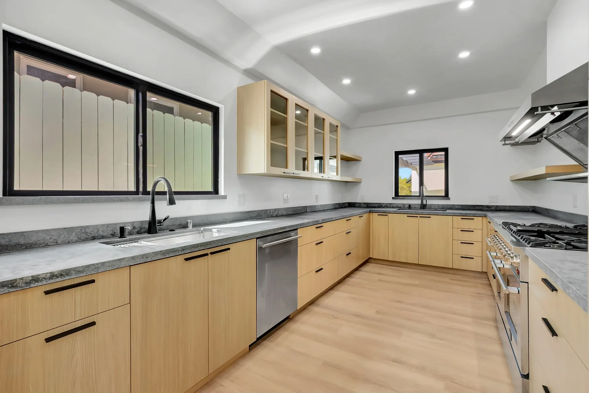 1145 S Longwood Ave Mid-Wilshire — Kitchen: Spacious kitchen with glass-front cabinets and granite countertops
