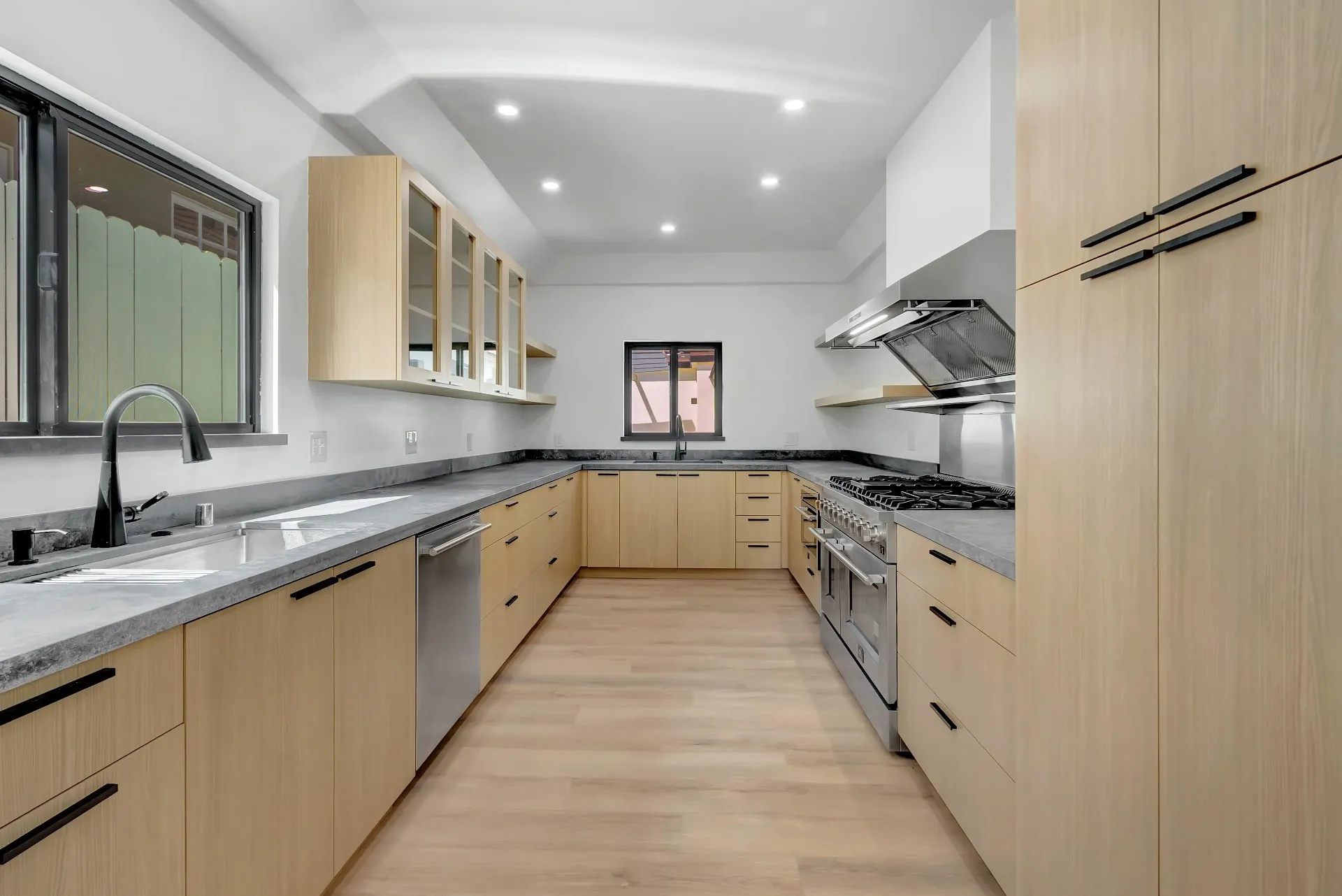 1145 S Longwood Ave Mid-Wilshire — Kitchen: Kitchen layout showcasing ample counter space and premium appliances