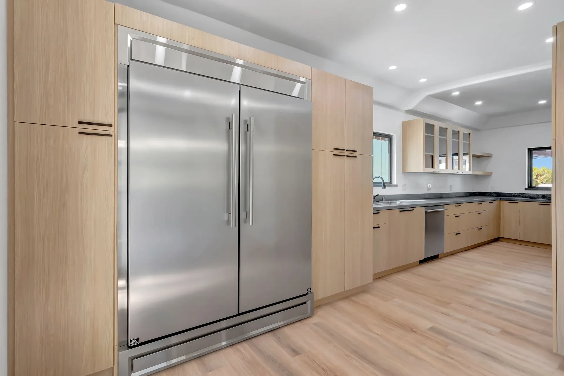 1145 S Longwood Ave Mid-Wilshire — Kitchen: Built-in refrigeration and elegant wood cabinetry with modern hardware