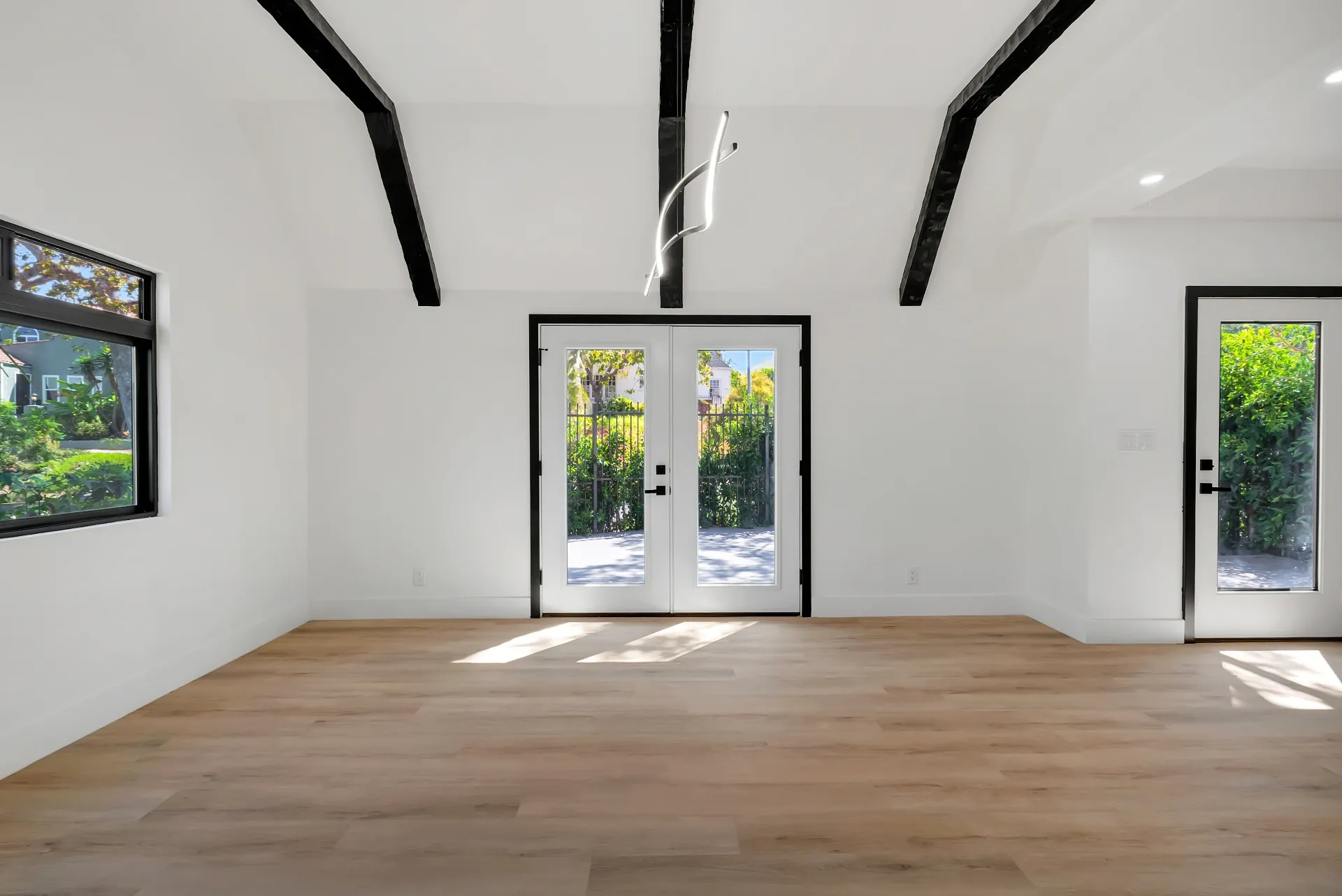 1145 S Longwood Ave Mid-Wilshire — Living: Spacious living area with French doors and garden access