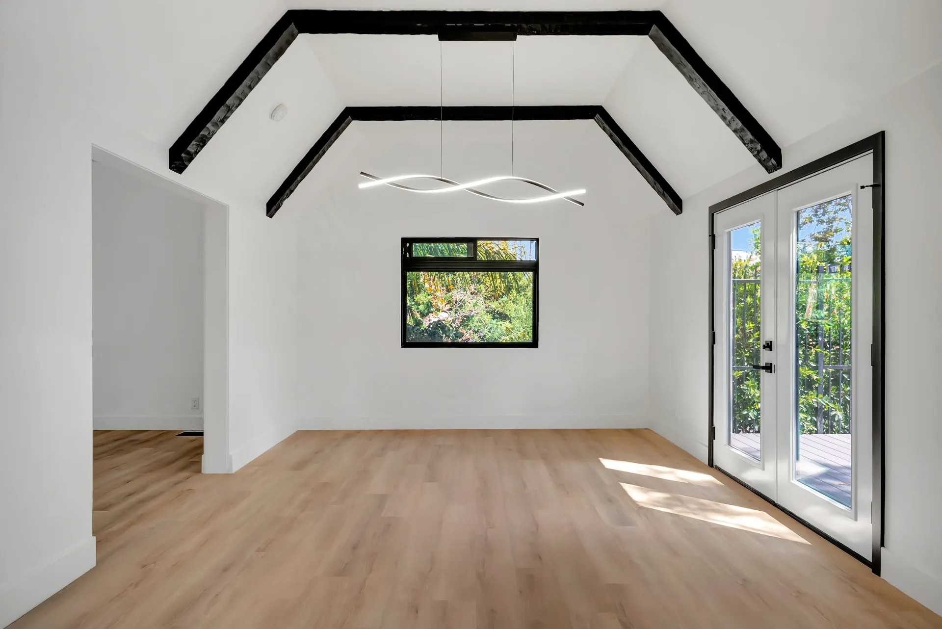 1145 S Longwood Ave Mid-Wilshire — Living: Dining area with Spanish ceiling details and patio access