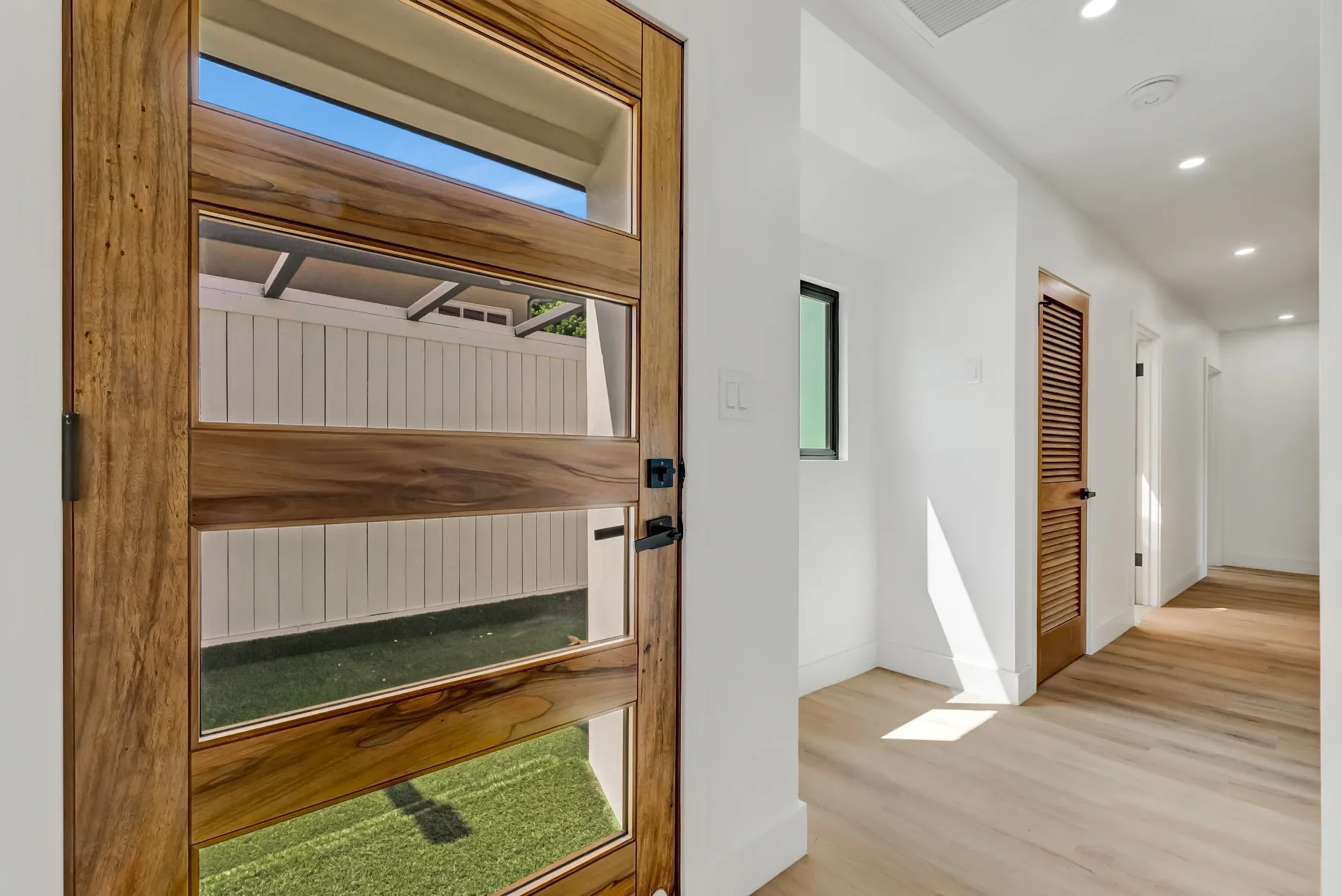 1145 S Longwood Ave Mid-Wilshire — Living: Hallway with wood-clad window and skylight detail