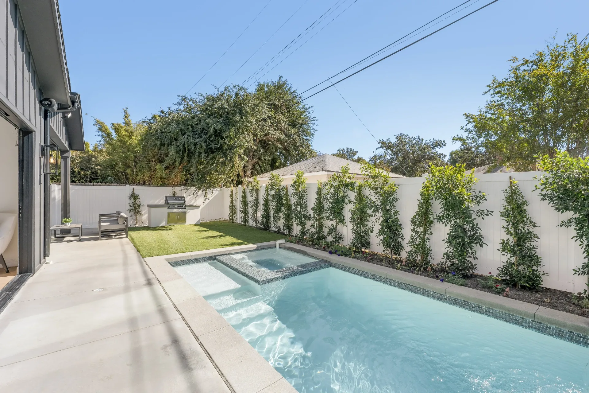 14602 Morrison St — Backyard: Daytime pool and spa area with professional landscaping and outdoor entertainment space