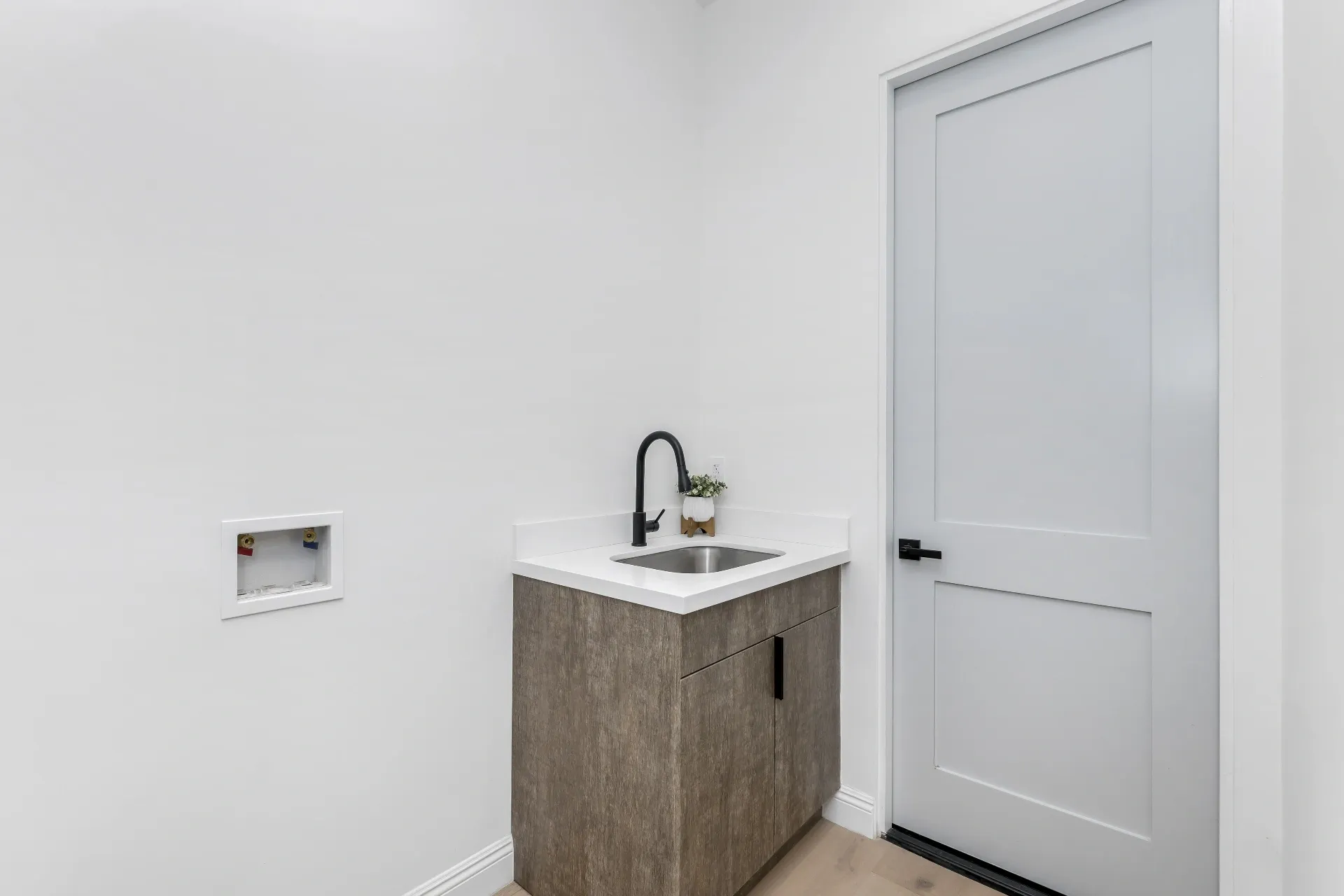 14602 Morrison St — Bathrooms: Utility room with wood-grain vanity and undermount sink