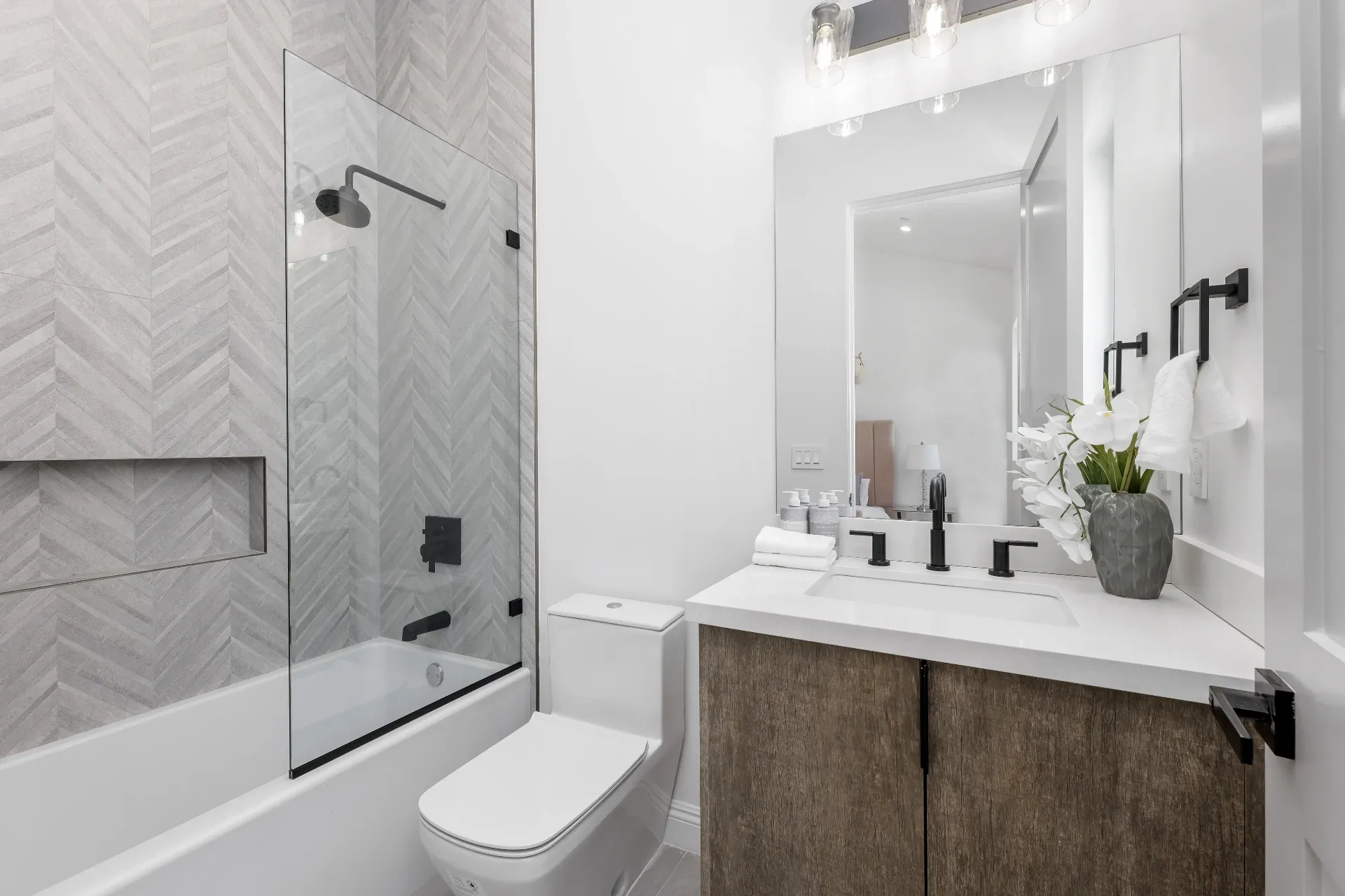14602 Morrison St — Bathrooms: Full bathroom with herringbone tile shower, dual vanity, and modern fixtures