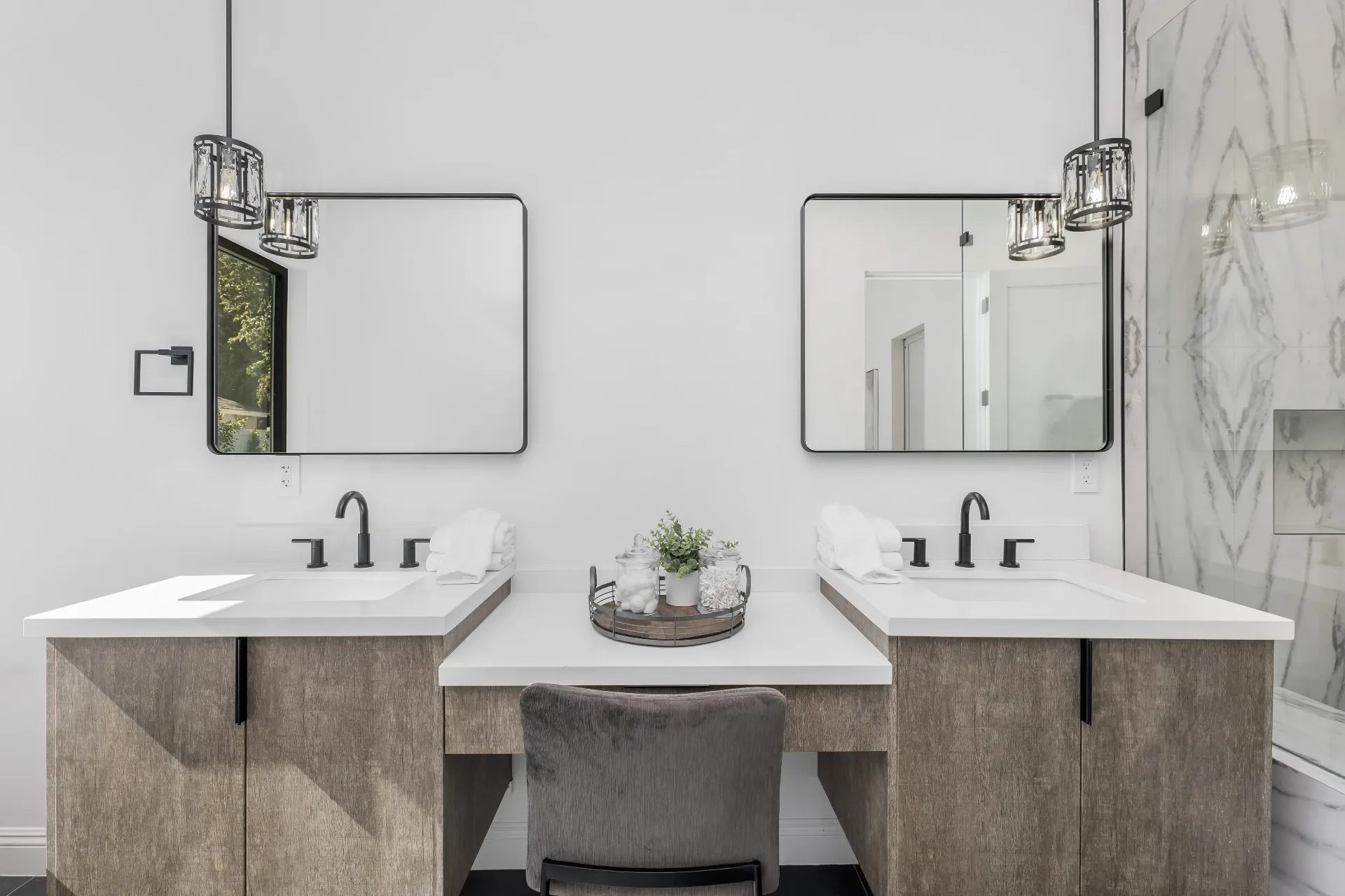 14602 Morrison St — Bathrooms: Luxurious dual vanity setup with crystal pendant lighting and marble accents