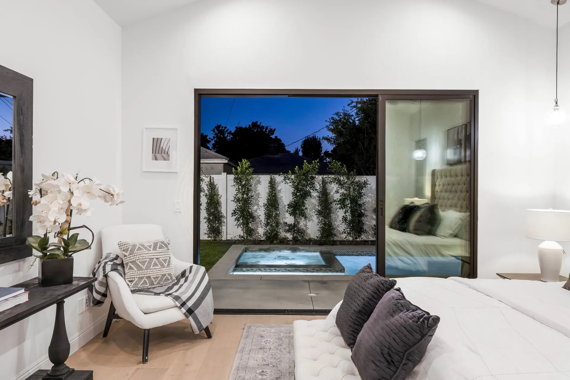 14602 Morrison St — Bedrooms: Primary bedroom with pool views, seating area, and marble bathroom access