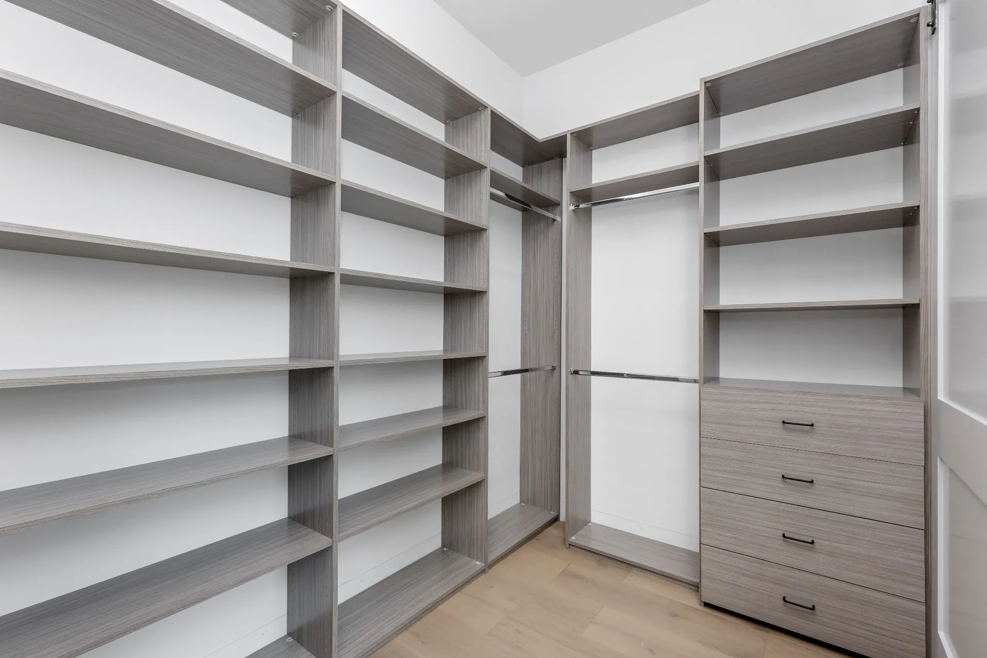 14602 Morrison St — Bedrooms: Walk-in closet with wood grain finishes and custom organization system