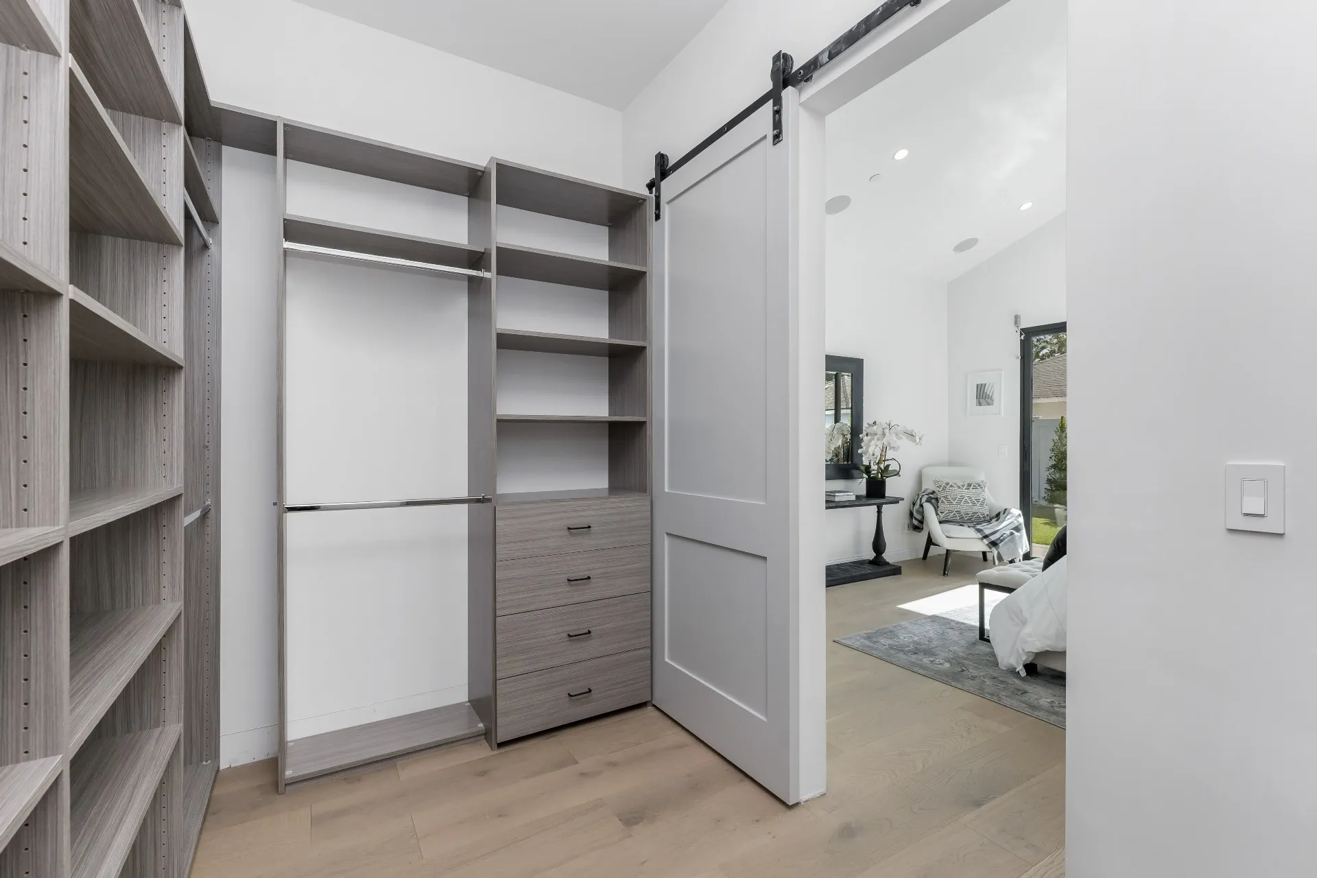 14602 Morrison St — Bedrooms: Master closet with barn door and view to bedroom seating area