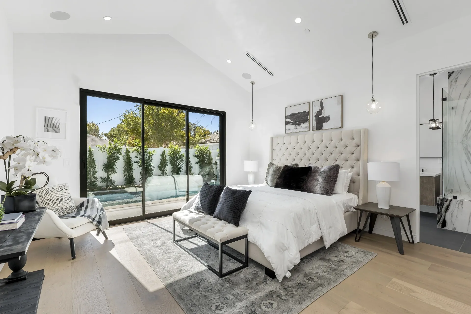 14602 Morrison St — Bedrooms: Primary bedroom with vaulted ceiling, pool access, and luxury finishes