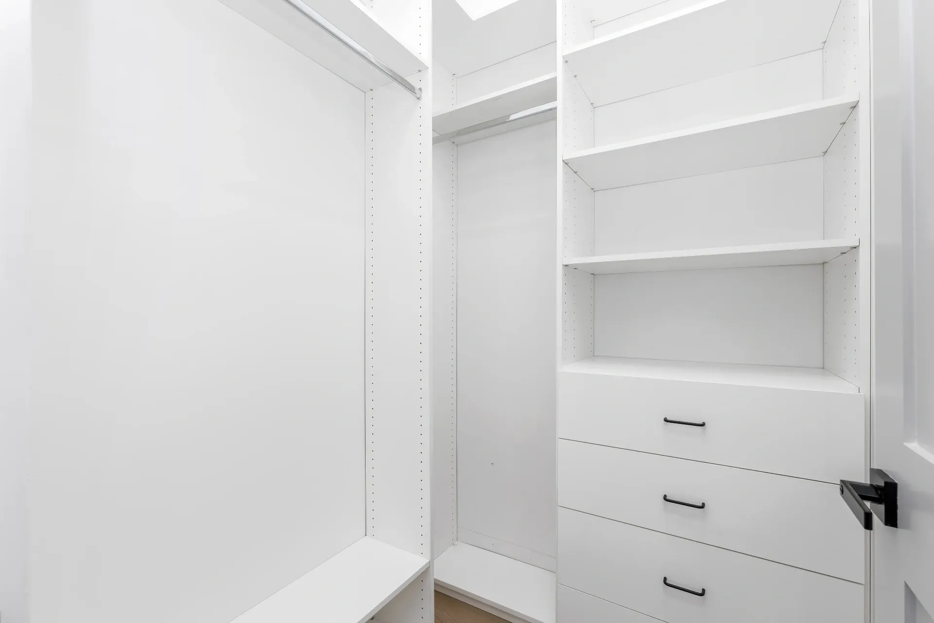 14602 Morrison St — Bedrooms: Walk-in closet with white custom cabinetry and drawers