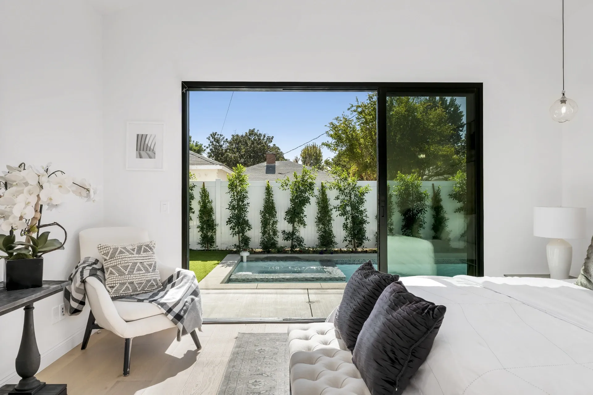 14602 Morrison St — Bedrooms: Secondary bedroom with pool views and contemporary furnishings
