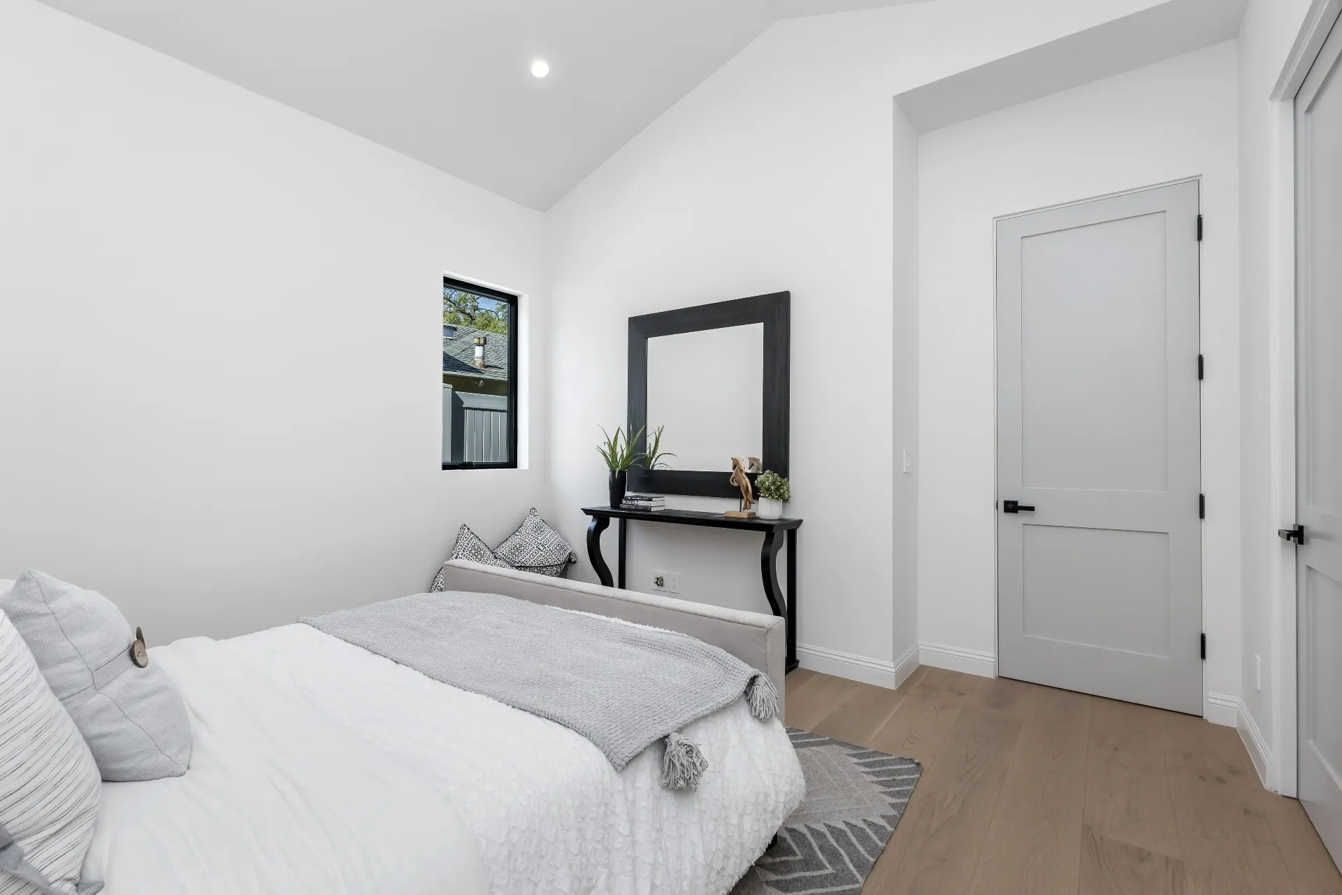 14602 Morrison St — Bedrooms: Guest bedroom with neutral tones and contemporary console table