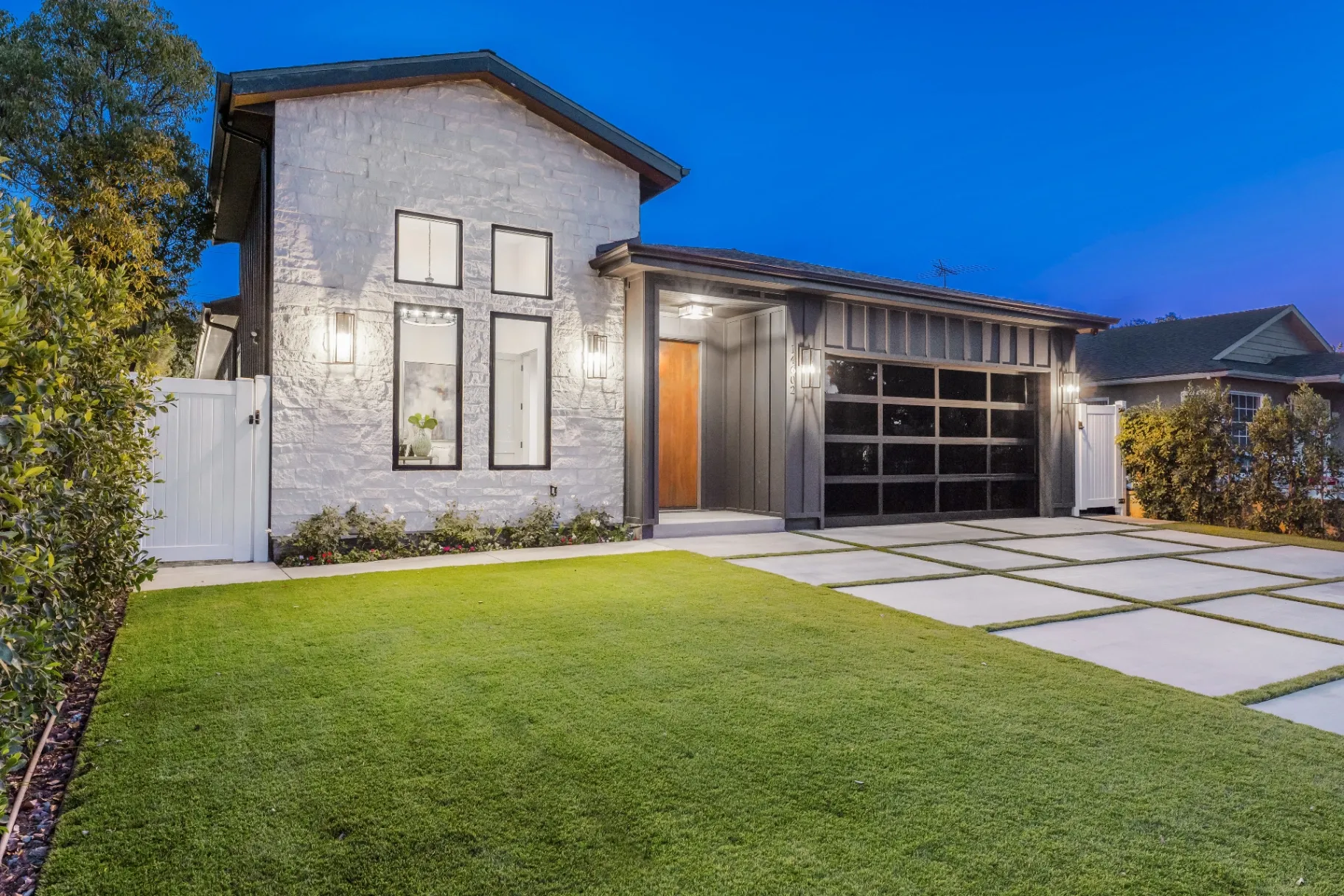 14602 Morrison St — Exterior: Side angle view highlighting architectural details and glass garage door