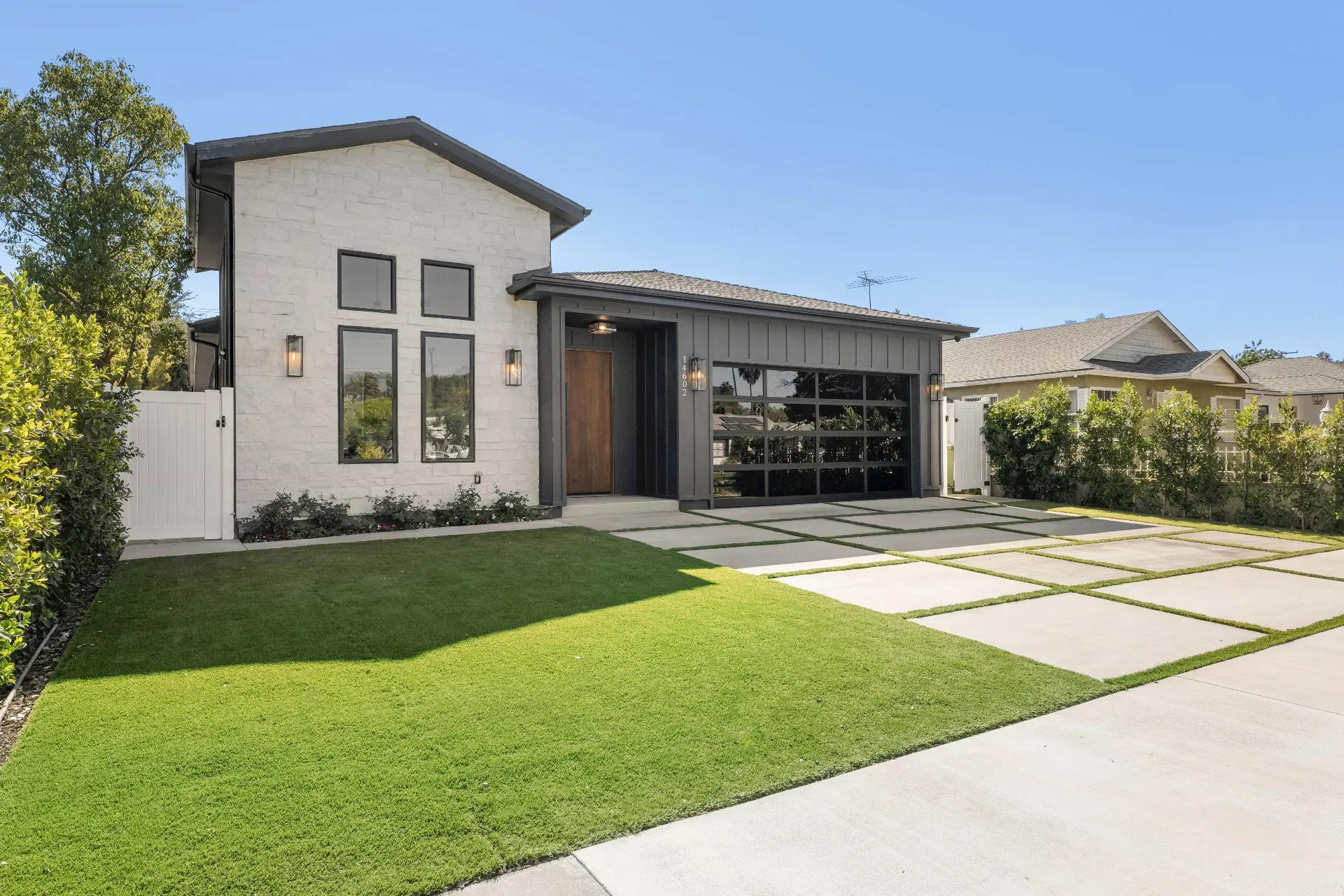 14602 Morrison St — Exterior: Daytime front view with clear blue sky showcasing modern farmhouse design
