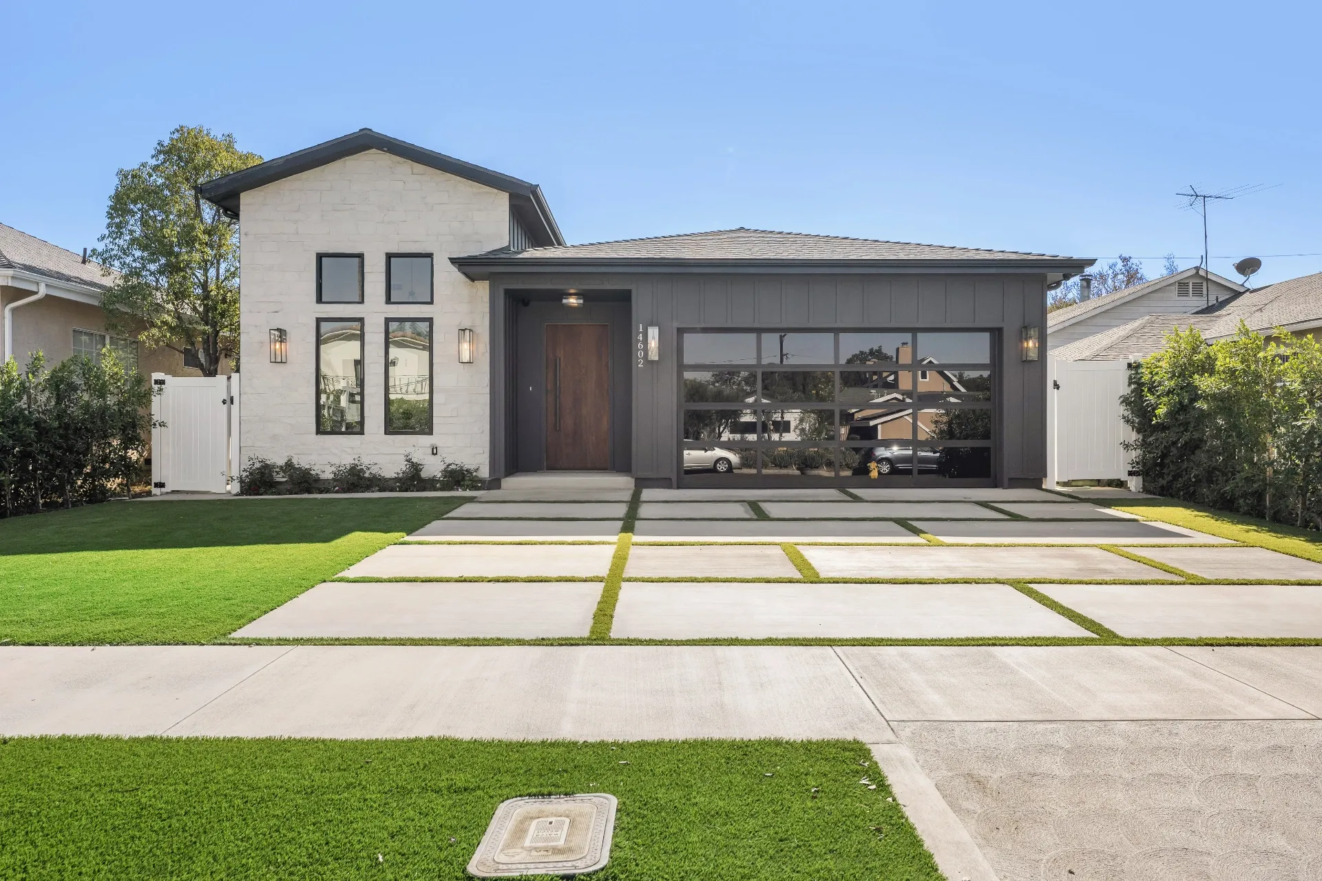 14602 Morrison St — Exterior: Front elevation with visible address number 14602 and glass garage door