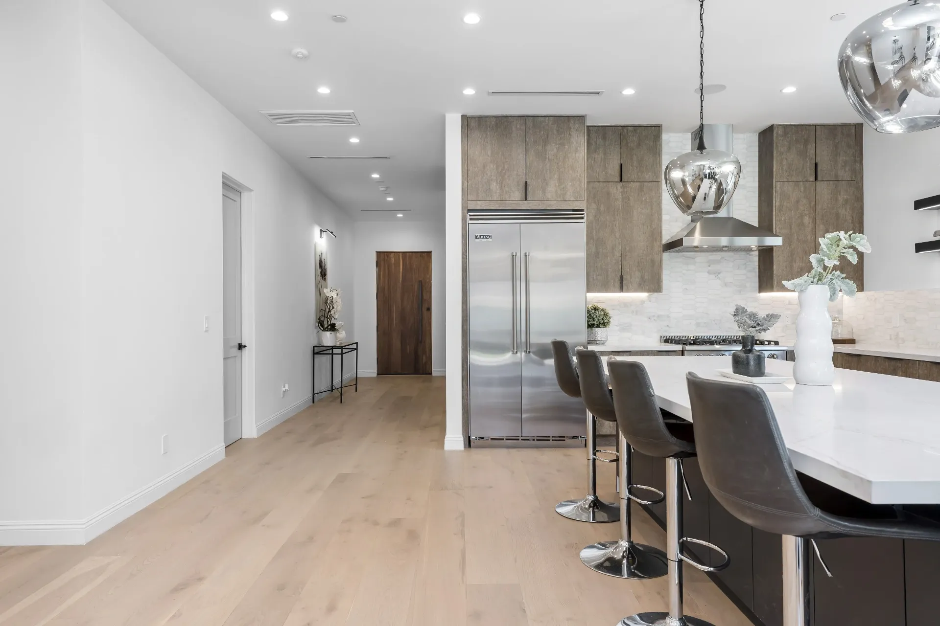14602 Morrison St — Kitchen: Kitchen with Viking refrigerator, chrome pendants, and bar seating