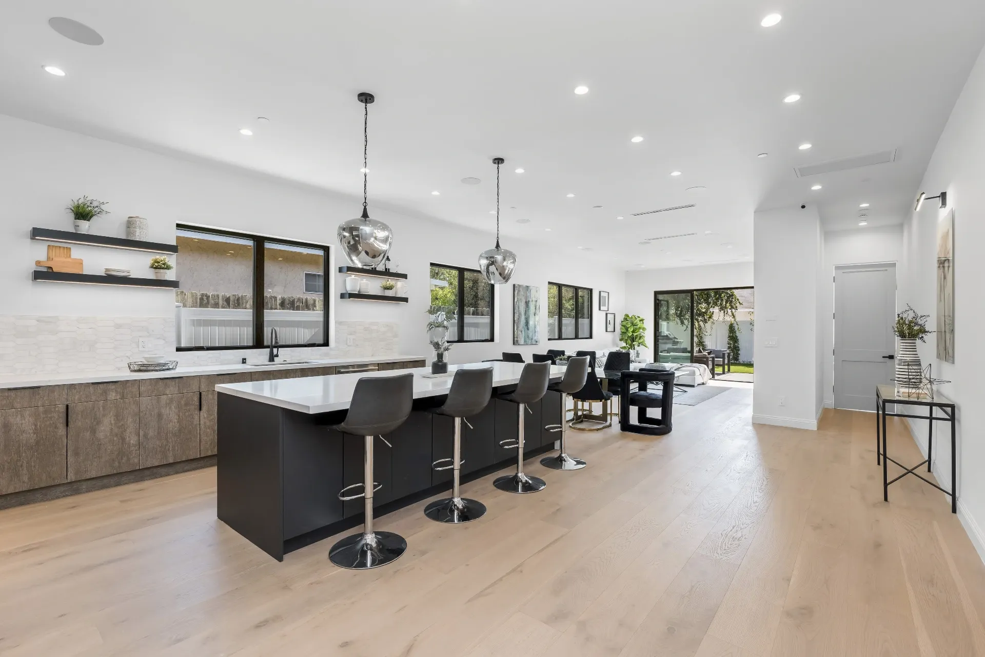 14602 Morrison St — Kitchen: Open-concept kitchen flowing to living space with pool views