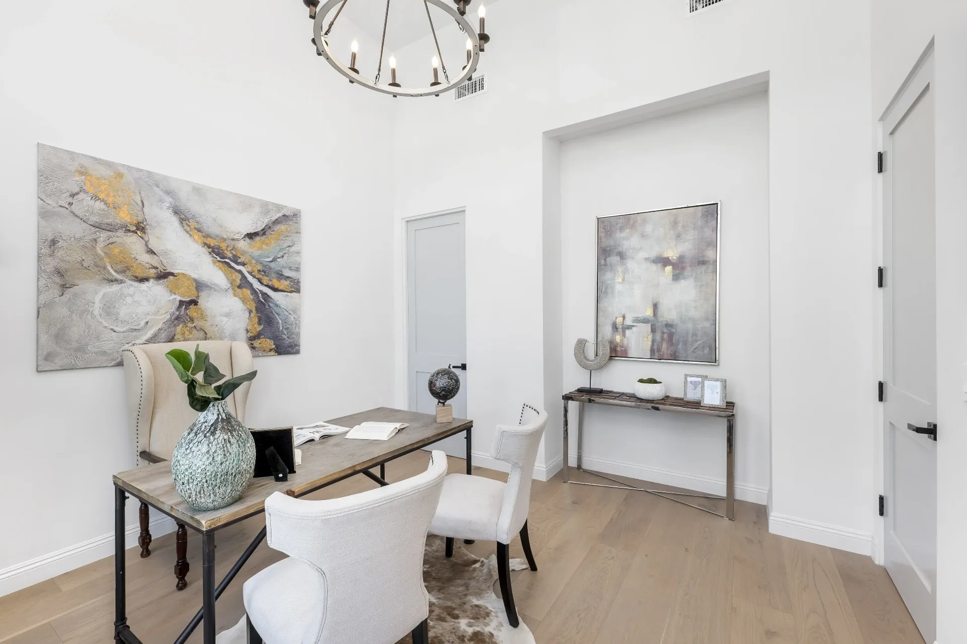 14602 Morrison St — Living Areas: Home office with circular chandelier and abstract artwork