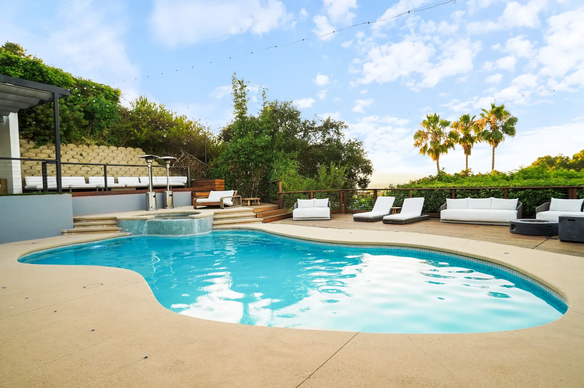 11308 Dona Teresa Dr — Backyard: Resort-style pool area with lounge chairs and spa featuring mountain backdrop views