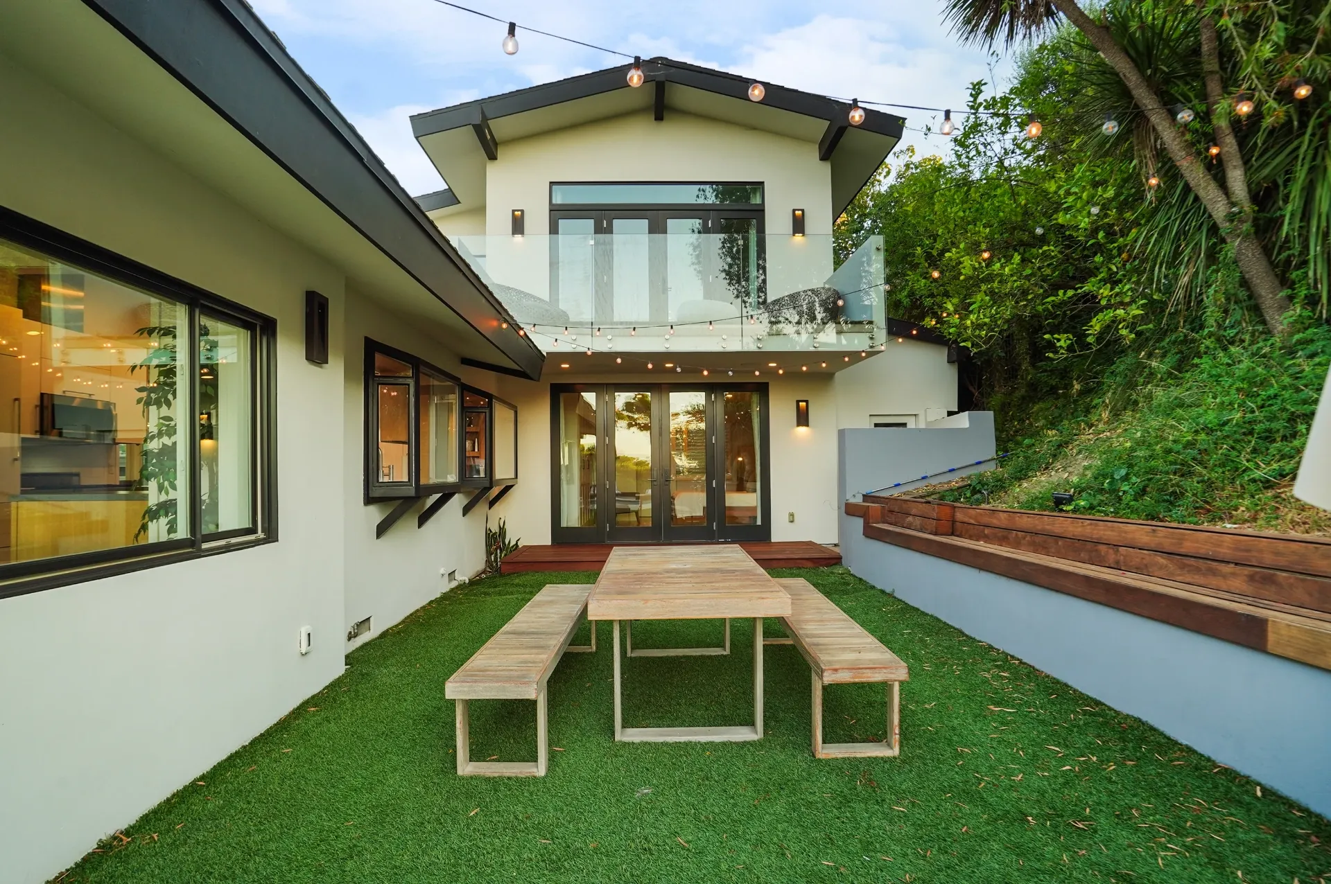 11308 Dona Teresa Dr — Backyard: Side yard with teak picnic table on artificial grass and string lighting overhead