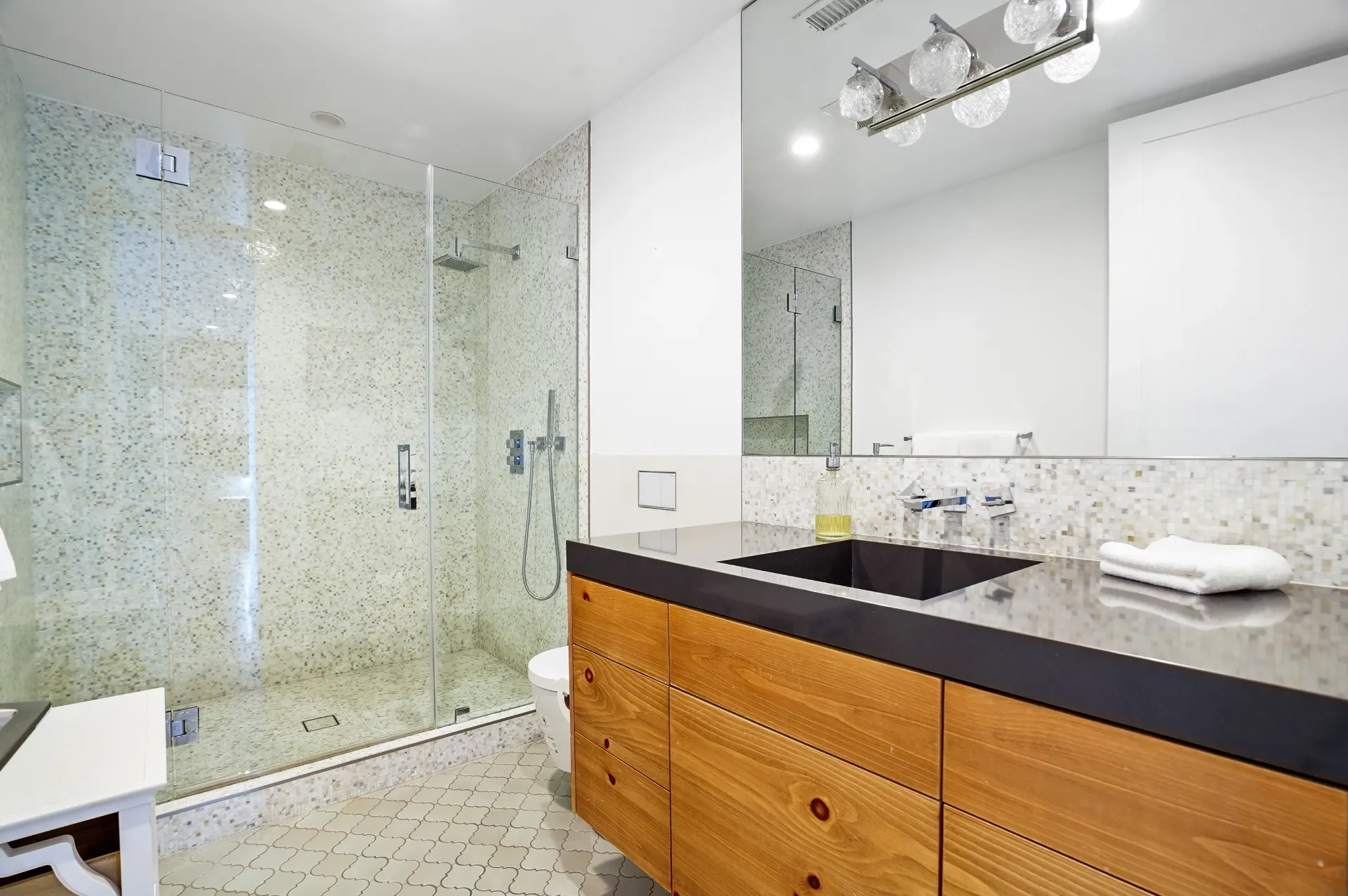 11308 Dona Teresa Dr — Bathrooms: Primary spa like bathroom with terrazzo flooring, mosaic tile shower, and warm wood vanity