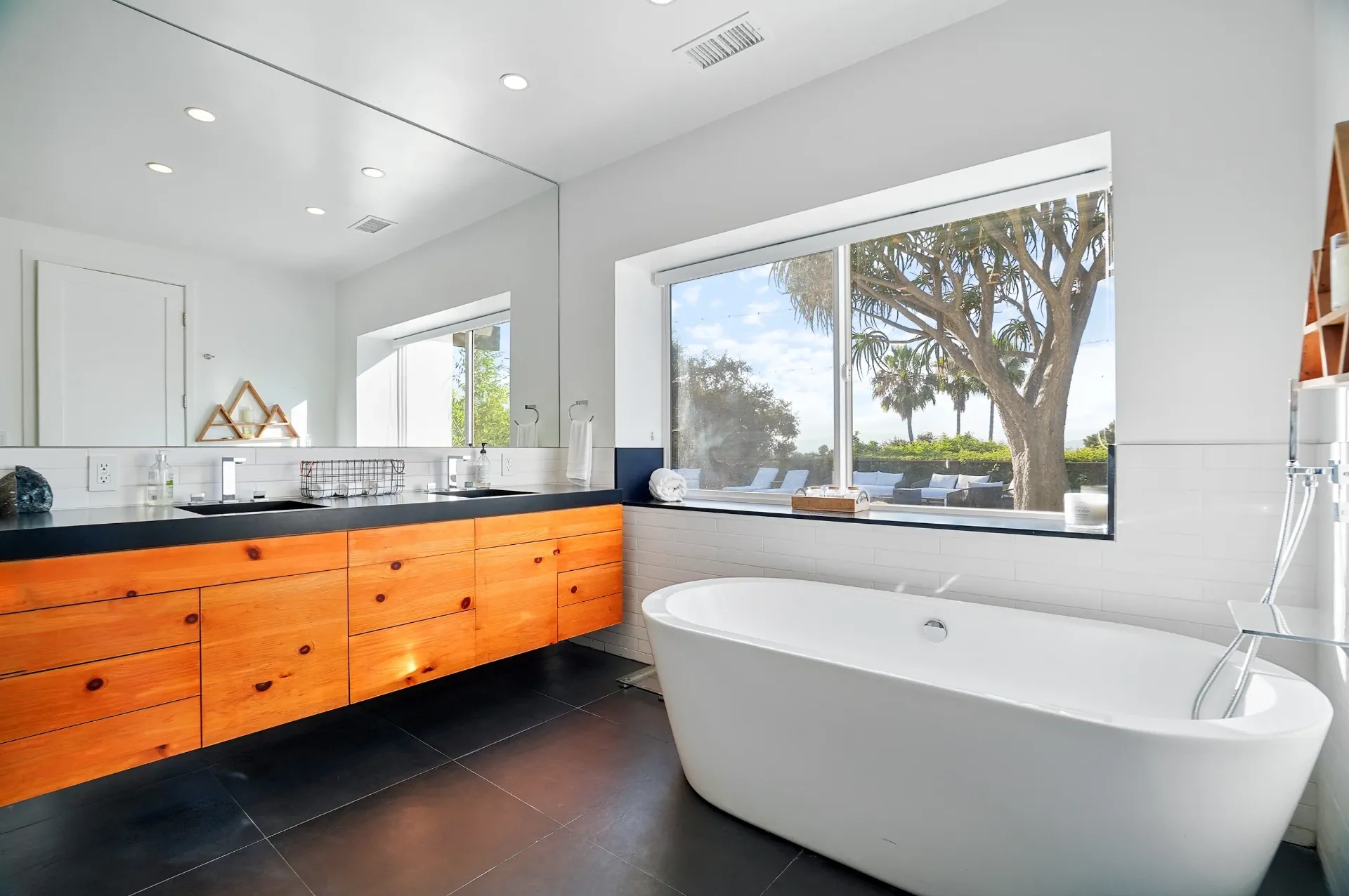 11308 Dona Teresa Dr — Bathrooms: Luxury primary bathroom with freestanding soaking tub and garden views