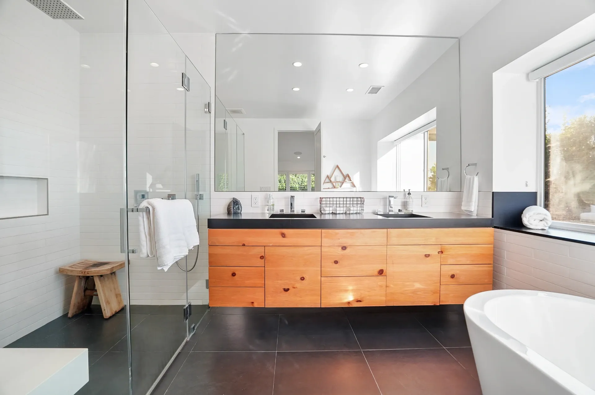 11308 Dona Teresa Dr — Bathrooms: Contemporary bathroom with dual vanity, floating wood cabinetry, and glass shower
