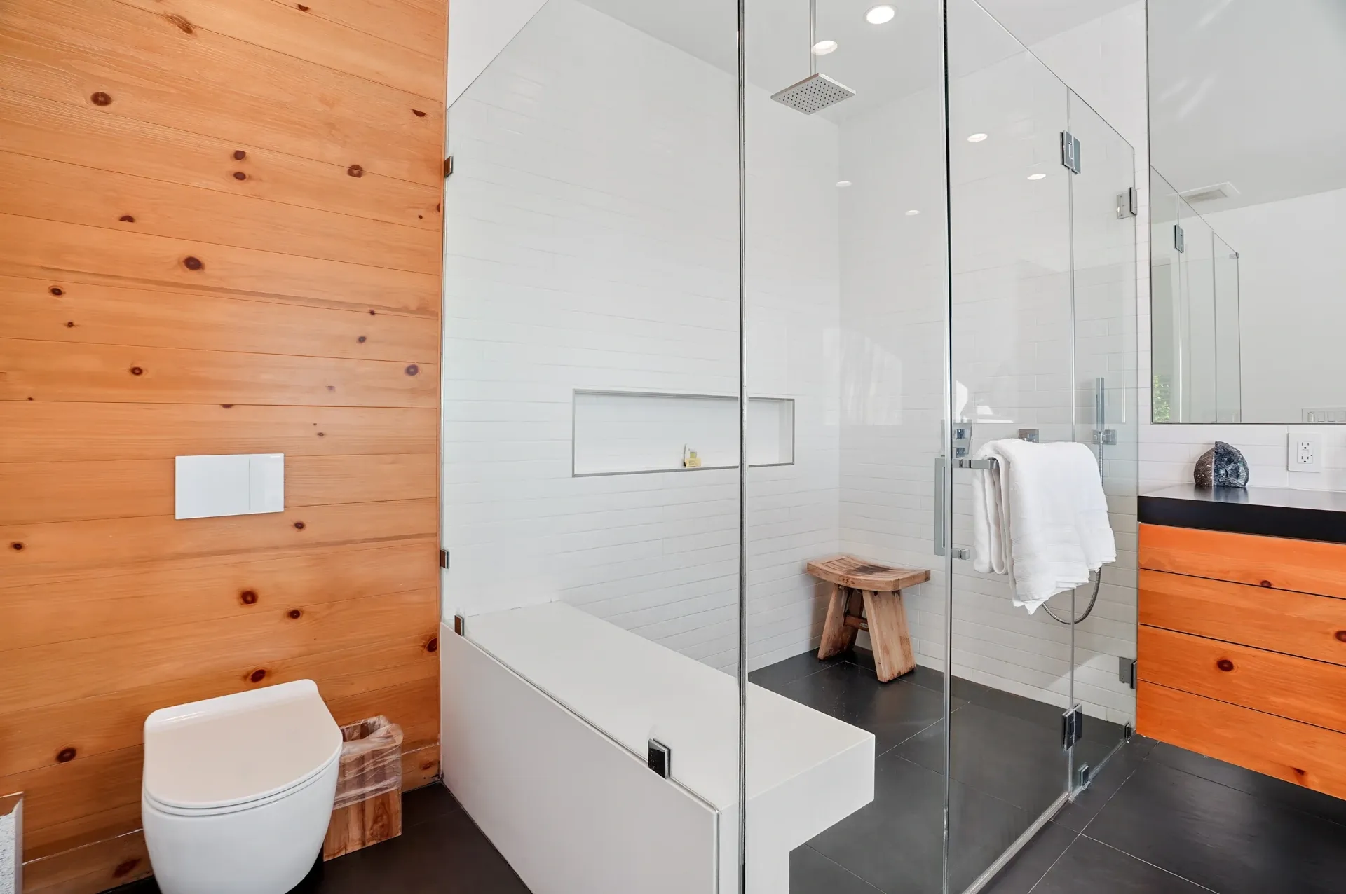 11308 Dona Teresa Dr — Bathrooms: Modern bathroom with wood accent wall, glass shower, and built-in bench seating