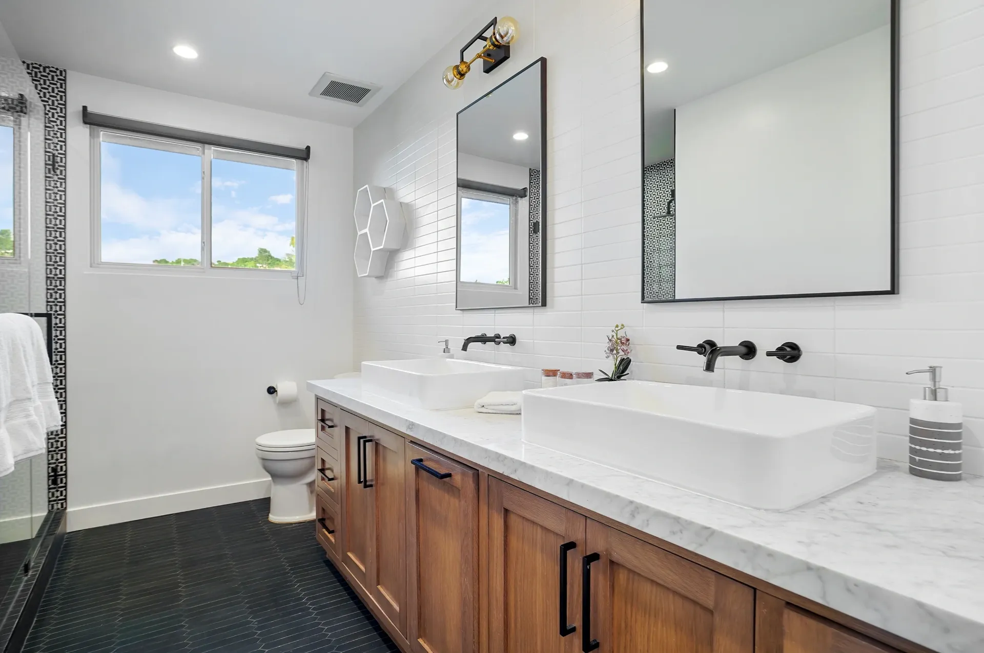 11308 Dona Teresa Dr — Bathrooms: Guest bathroom with dual vanity, white quartz countertops, and wood cabinetry