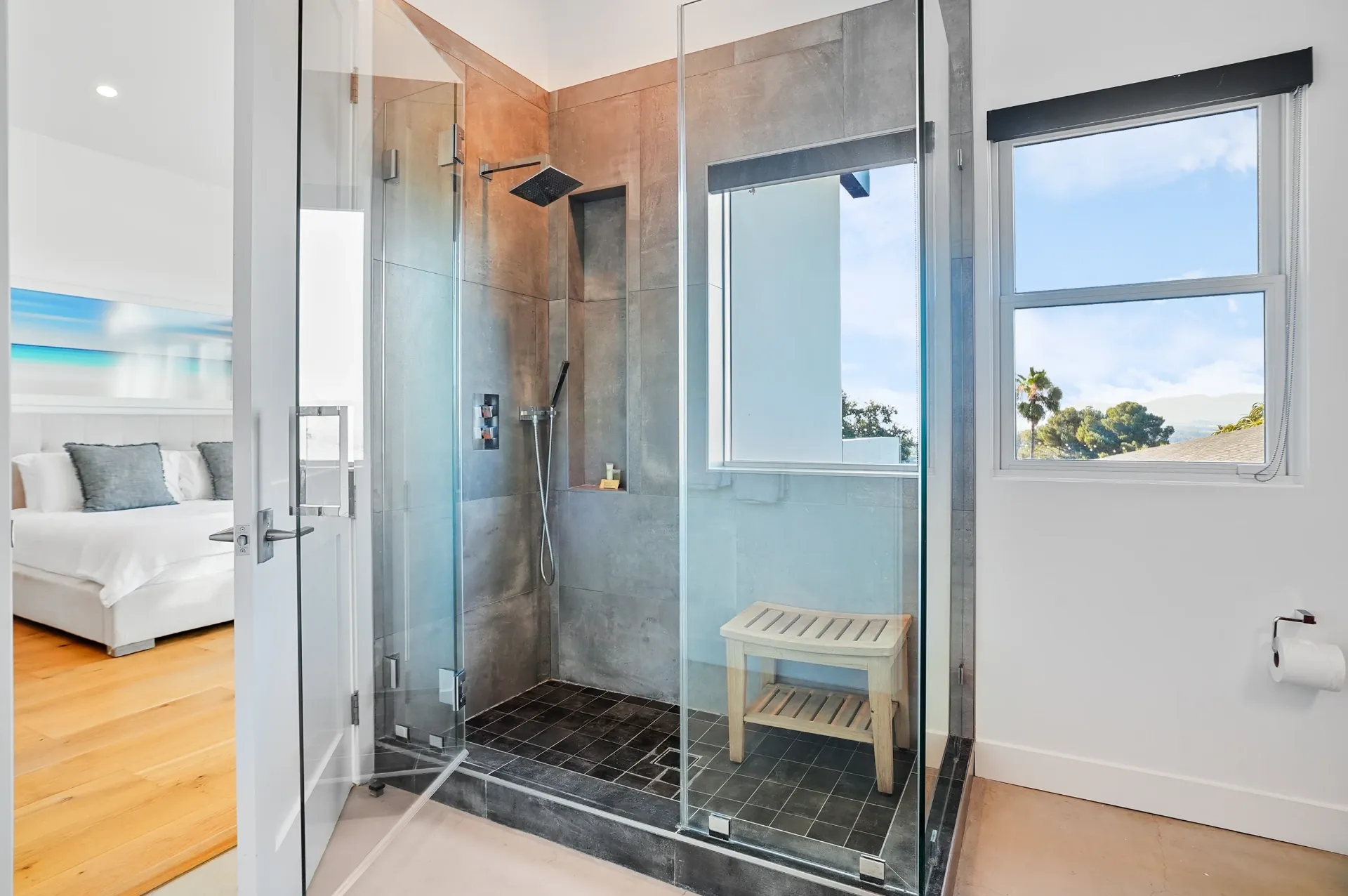 11308 Dona Teresa Dr — Bathrooms: Modern ensuite bathroom with glass shower and valley views through bedroom