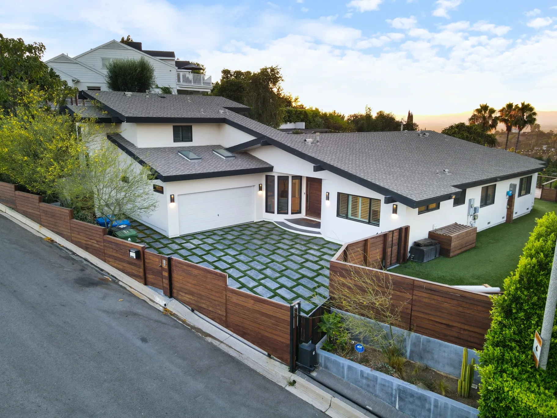 11308 Dona Teresa Dr — Exterior: Aerial view showcasing modern Studio City home with geometric turf driveway and contemporary architecture