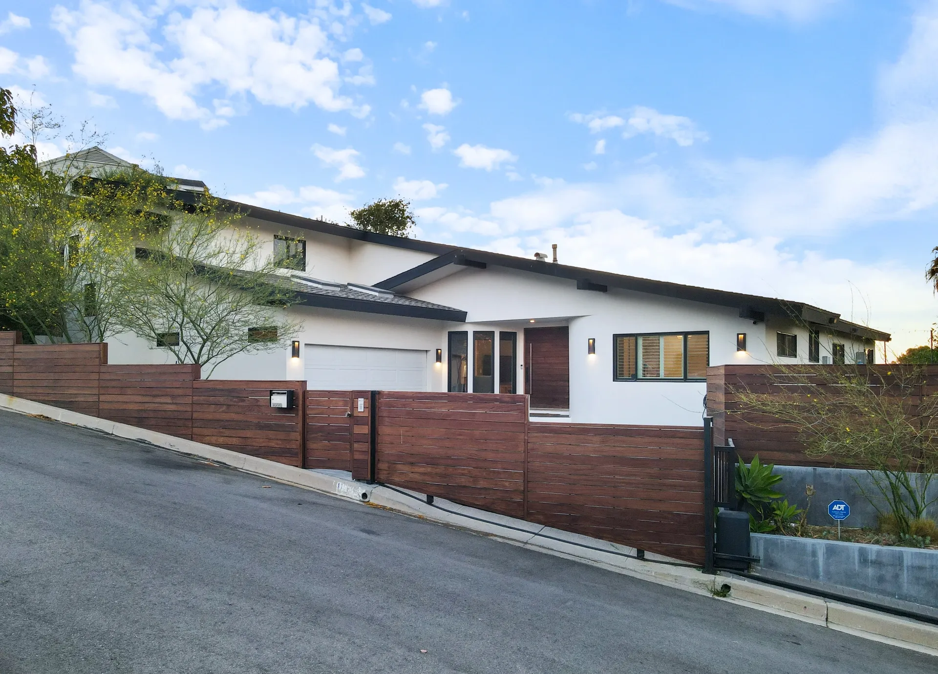 11308 Dona Teresa Dr — Exterior: Street-level view with horizontal wood fencing and clean contemporary design lines