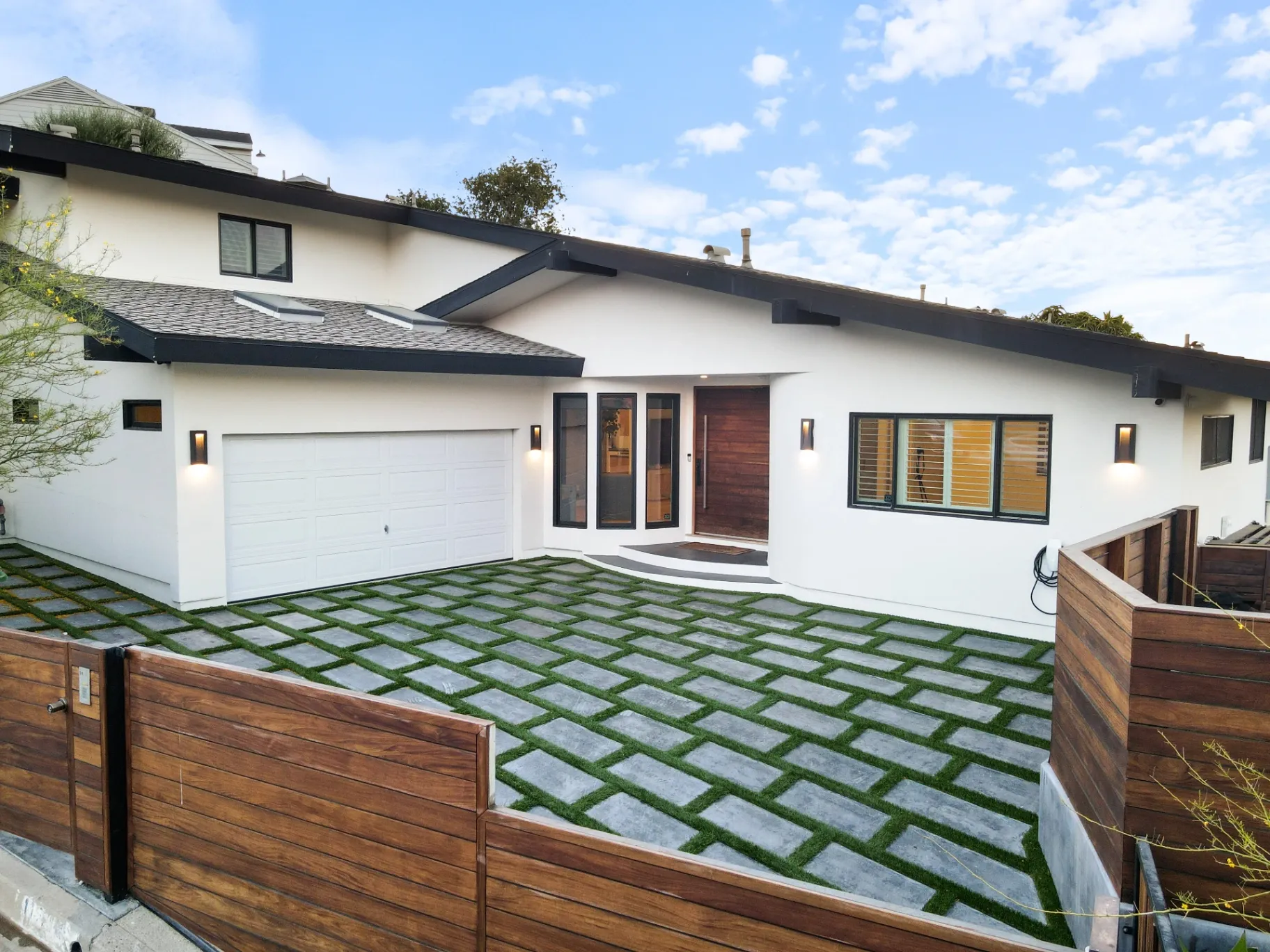 11308 Dona Teresa Dr — Exterior: Front elevation featuring white stucco walls, garage, and welcoming entrance with geometric driveway