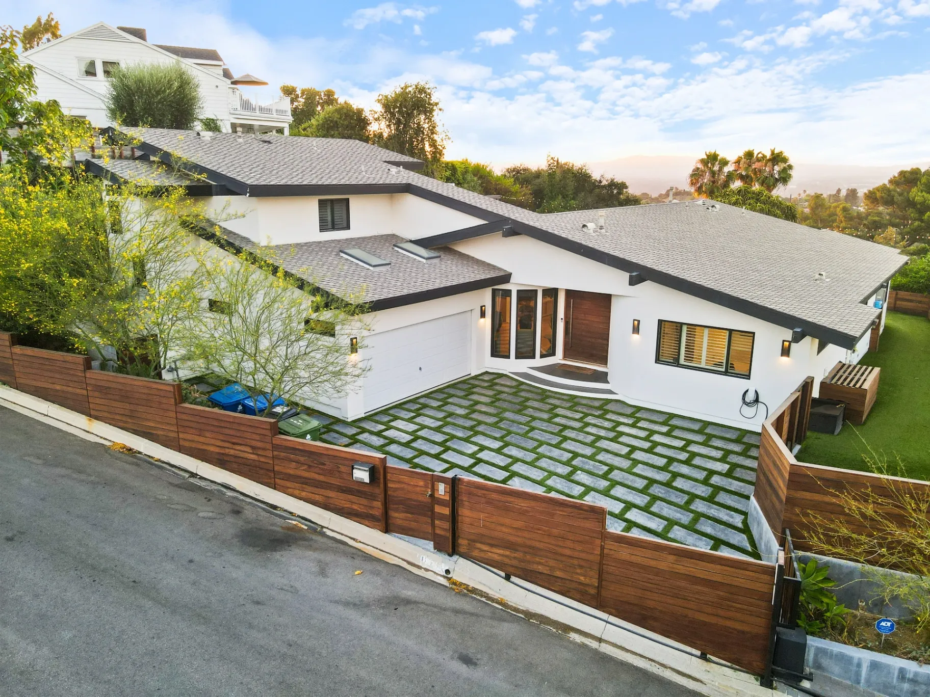 11308 Dona Teresa Dr — Exterior: Aerial side perspective highlighting the home's architectural design and landscaped surroundings