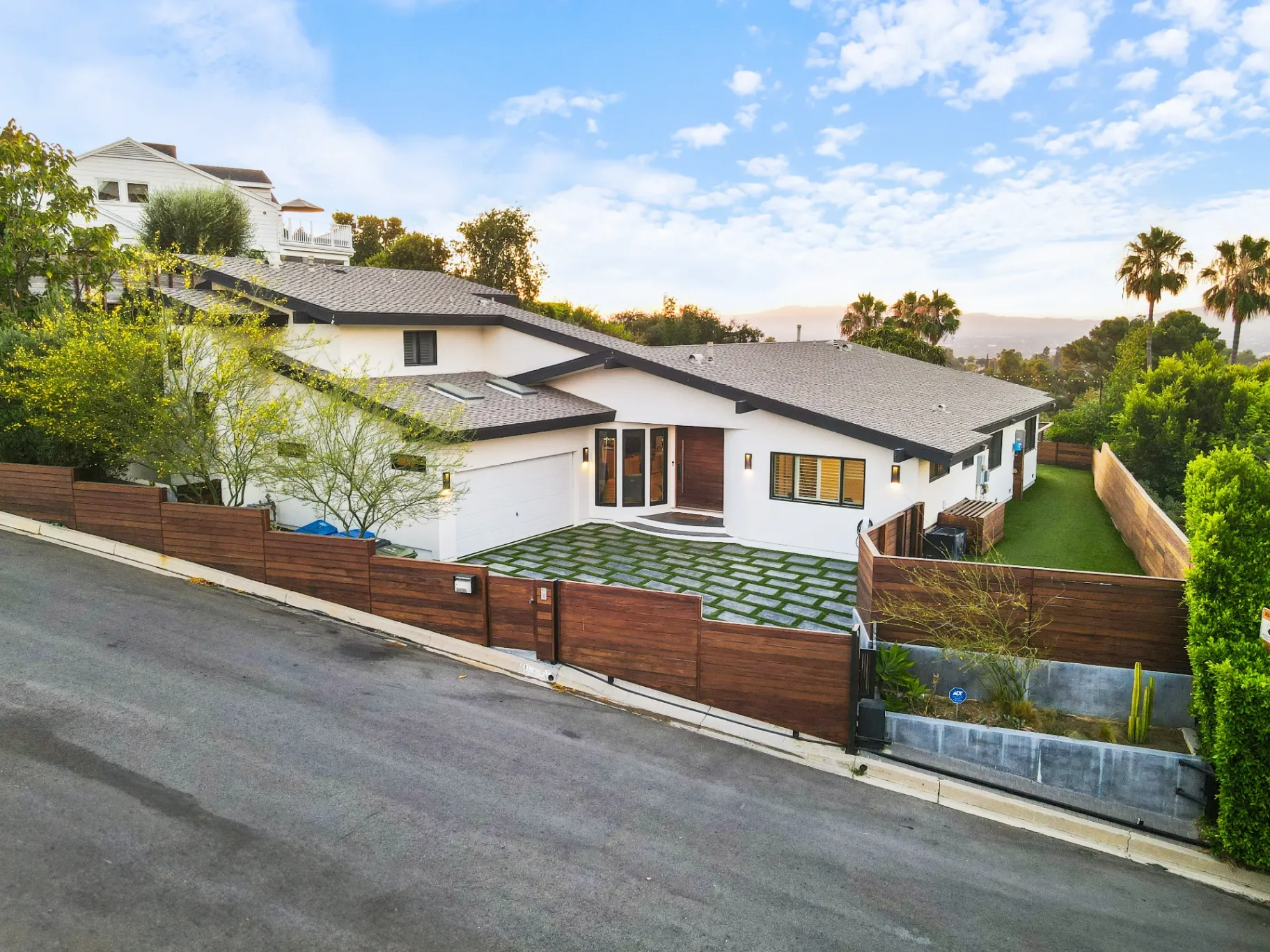 11308 Dona Teresa Dr — Exterior: Aerial view with panoramic Studio City valley backdrop and mature palm tree landscaping