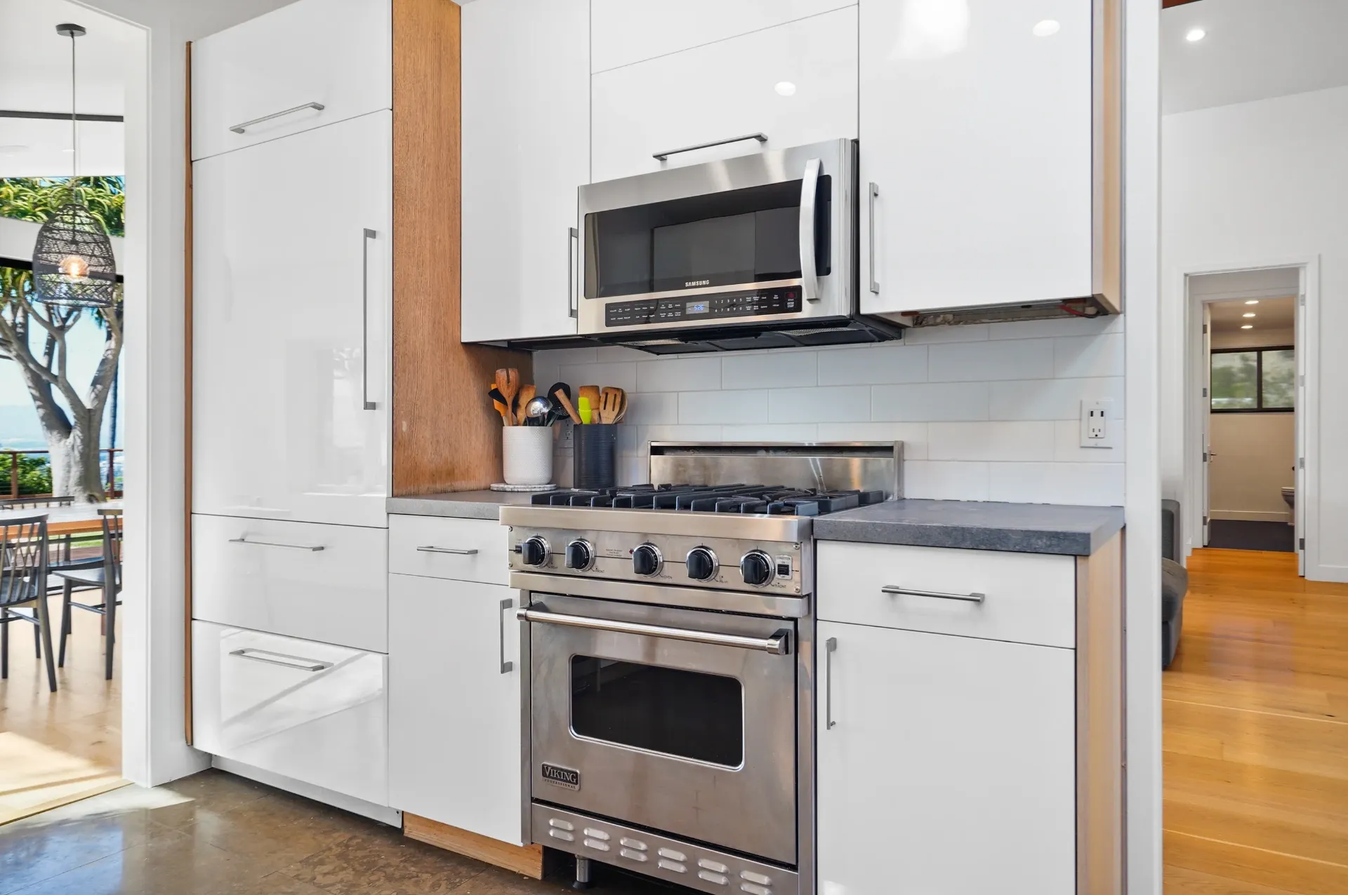 11308 Dona Teresa Dr — Kitchen: Chef's kitchen with Viking range, white cabinetry, and wood accents with outdoor views