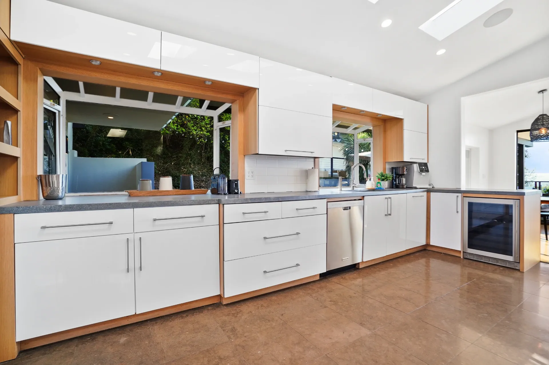 11308 Dona Teresa Dr — Kitchen: Modern kitchen with pass-through windows to outdoor bar and entertaining area