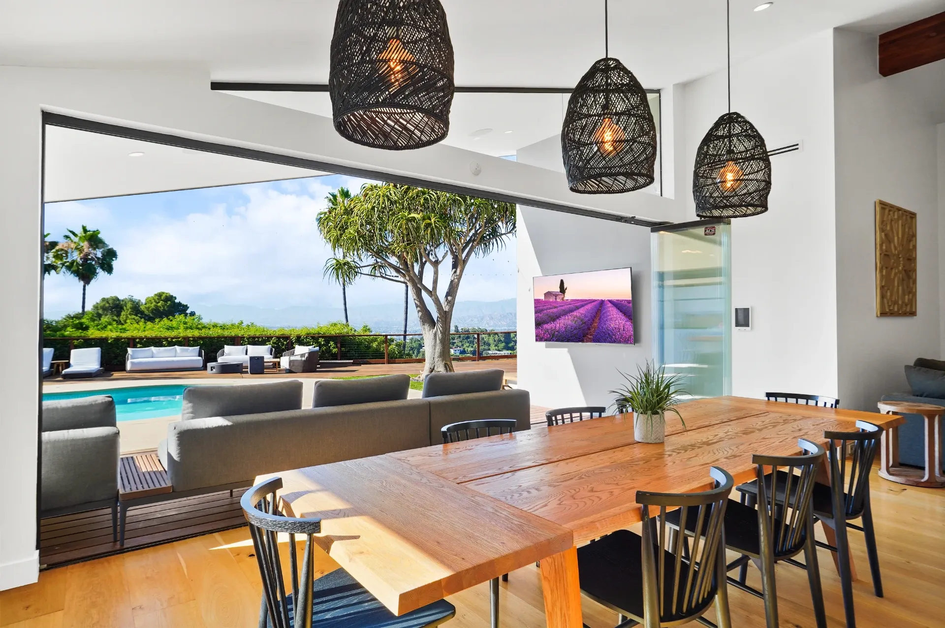 11308 Dona Teresa Dr — Kitchen: Dining space with live-edge wood table and panoramic outdoor living views