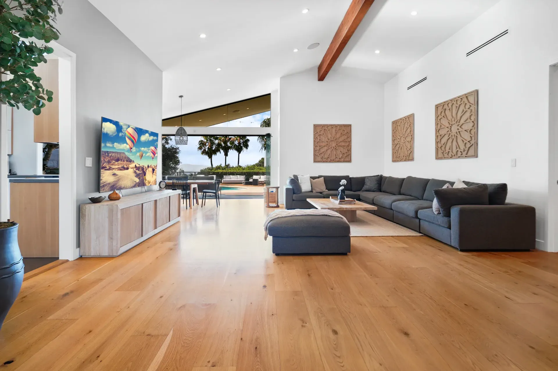 11308 Dona Teresa Dr — Living Areas: Open-concept living room with custom built-in media console and pool views