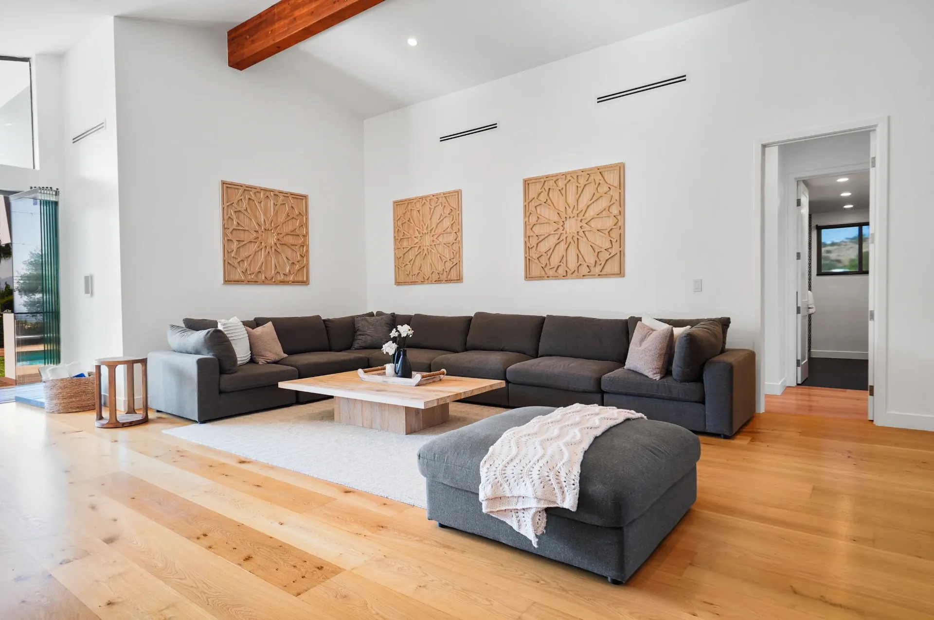 11308 Dona Teresa Dr — Living Areas: Living room with sectional seating and carved wood wall art