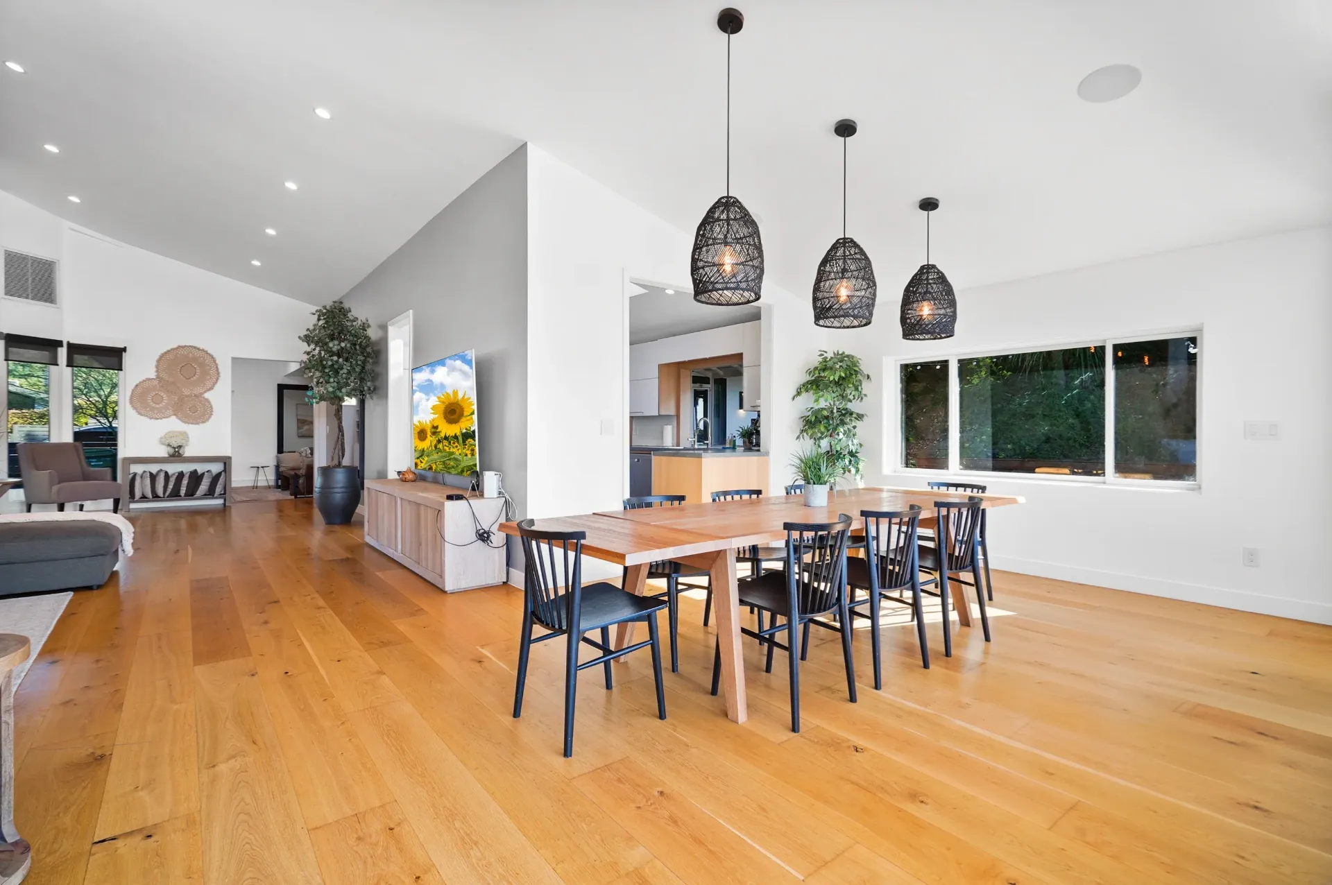 11308 Dona Teresa Dr — Living Areas: Open living and dining space with pendant lighting and garden views