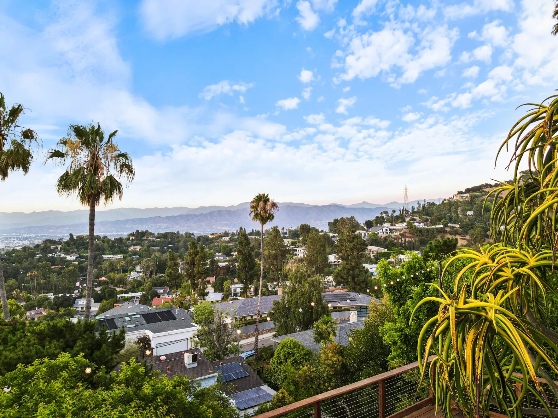 11308 Dona Teresa Dr — View: Expansive valley vista from property deck with mountain backdrop and palm trees