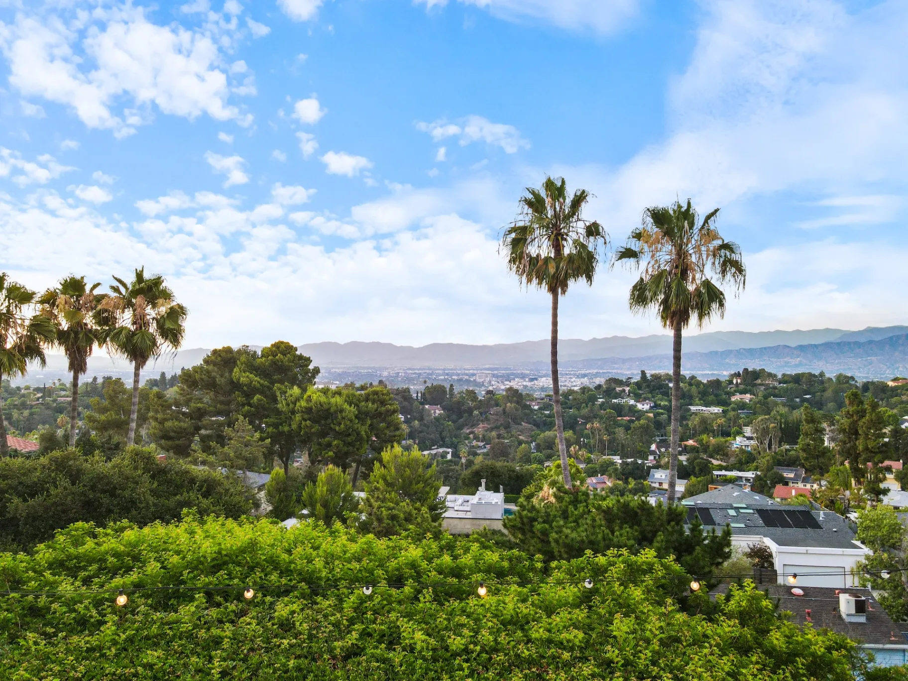 11308 Dona Teresa Dr — View: Wide valley panorama showcasing Studio City location with palm trees and blue skies