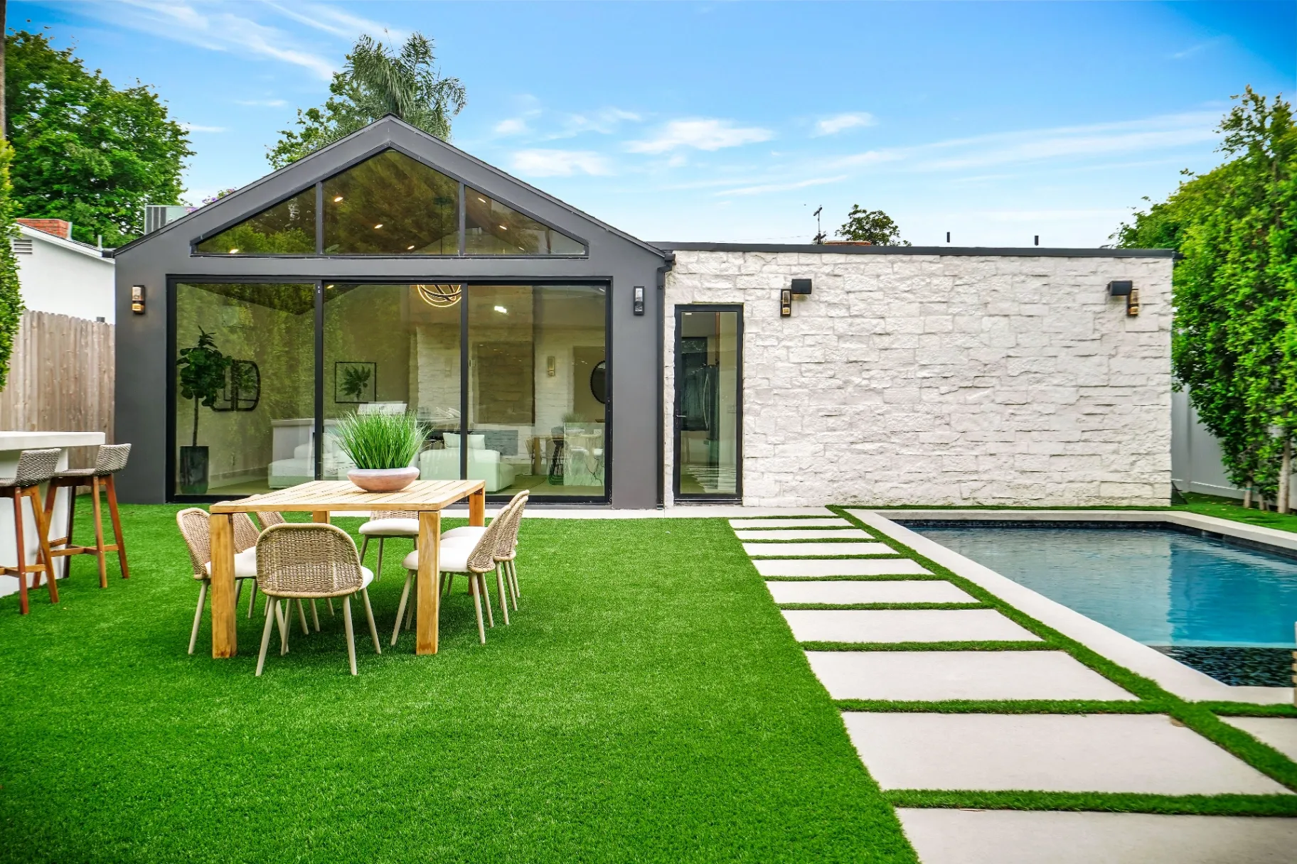 15602 Morrison St — Backyard: Backyard featuring pool, outdoor dining table, and seamless indoor-outdoor living