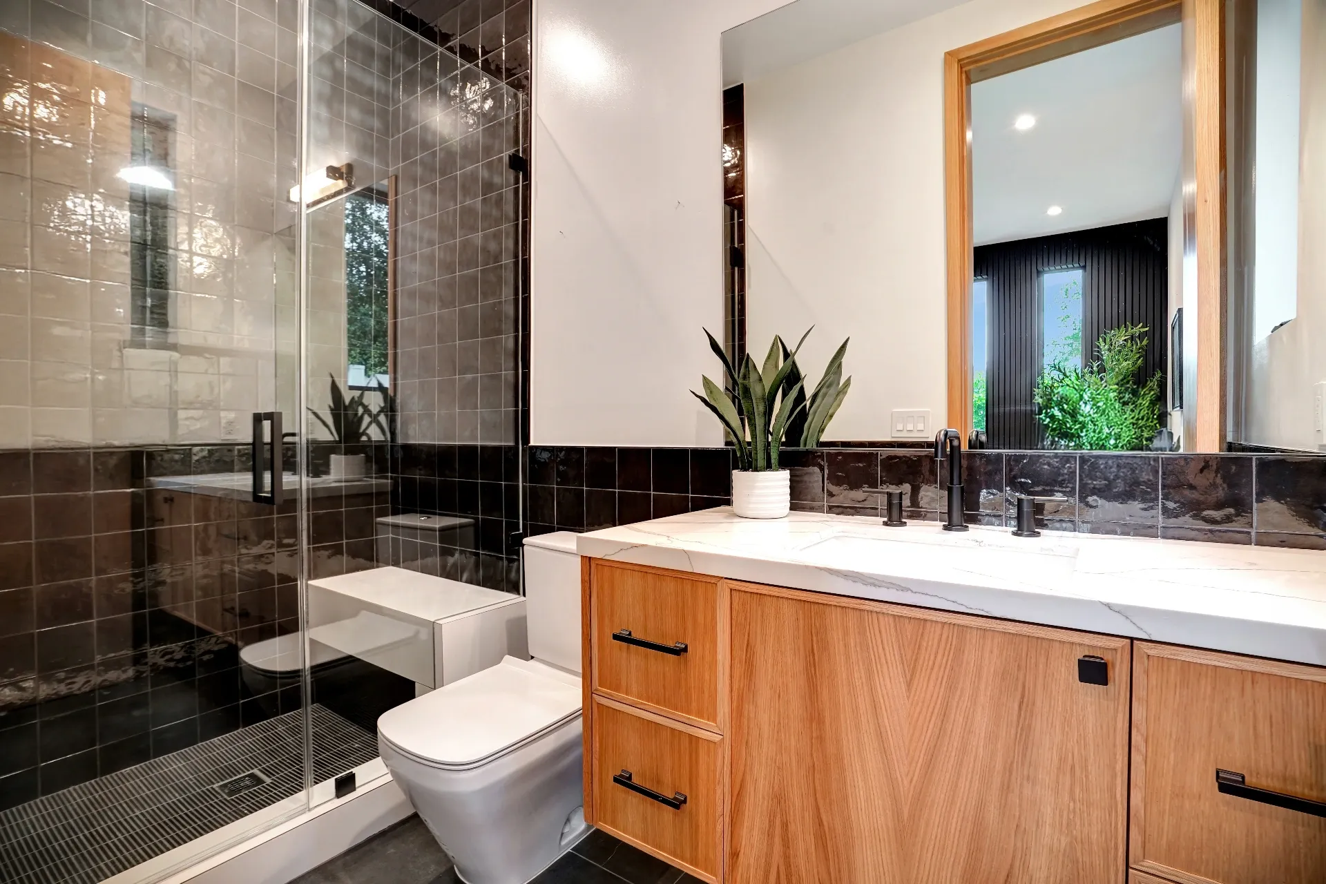 15602 Morrison St — Bathrooms: 15602 Morrison St — Modern bathroom with dark tile shower, wood vanity, marble countertops, and contemporary black fixtures
